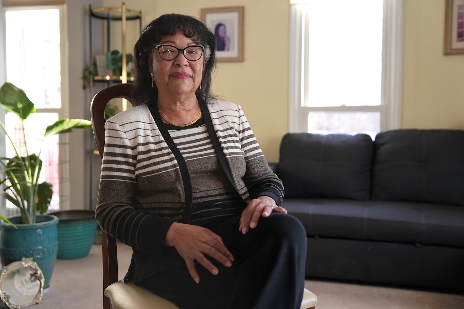 Dora Bronston, of Middletown, Ohio, sits for a portrait at her home, Tuesday, Jan. 14, 2025. The city is the hometown of Vice President-elect JD Vance. (AP Photo/Kareem Elgazzar)