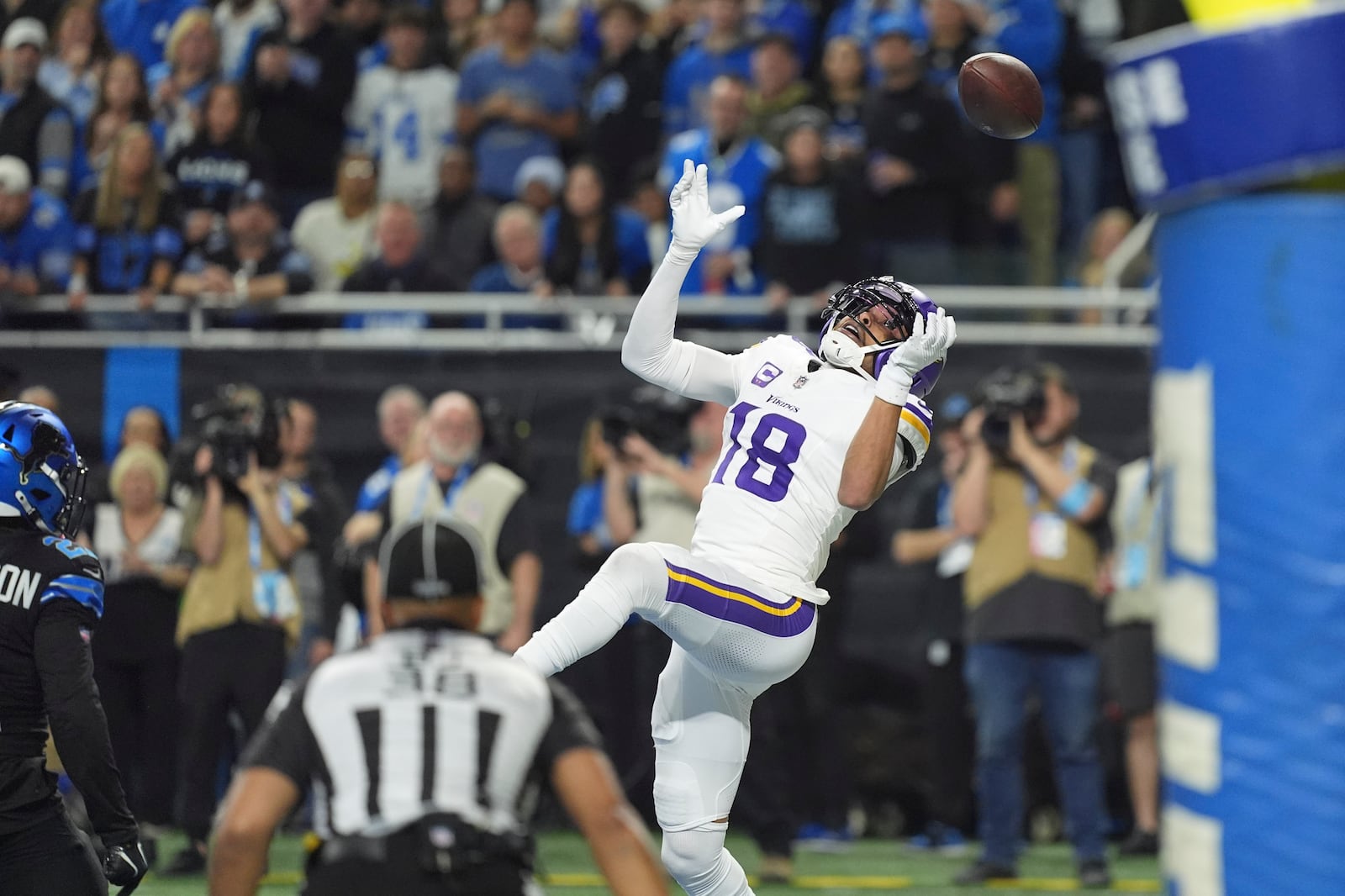 Minnesota Vikings wide receiver Justin Jefferson (18) can't make a catch against the Detroit Lions during the first half of an NFL football game Sunday, Jan. 5, 2025, in Detroit. (AP Photo/Charlie Riedel)