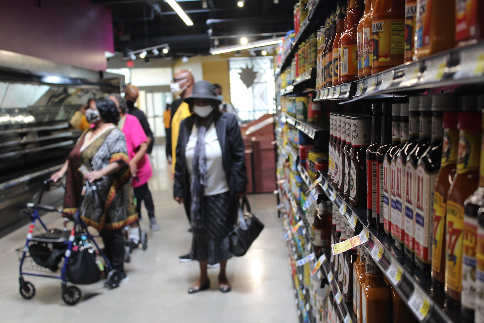 Nonperishable food products line the shelves of the Gem City Market, which is preparing to open on May 12. CORNELIUS FROLIK / STAFF