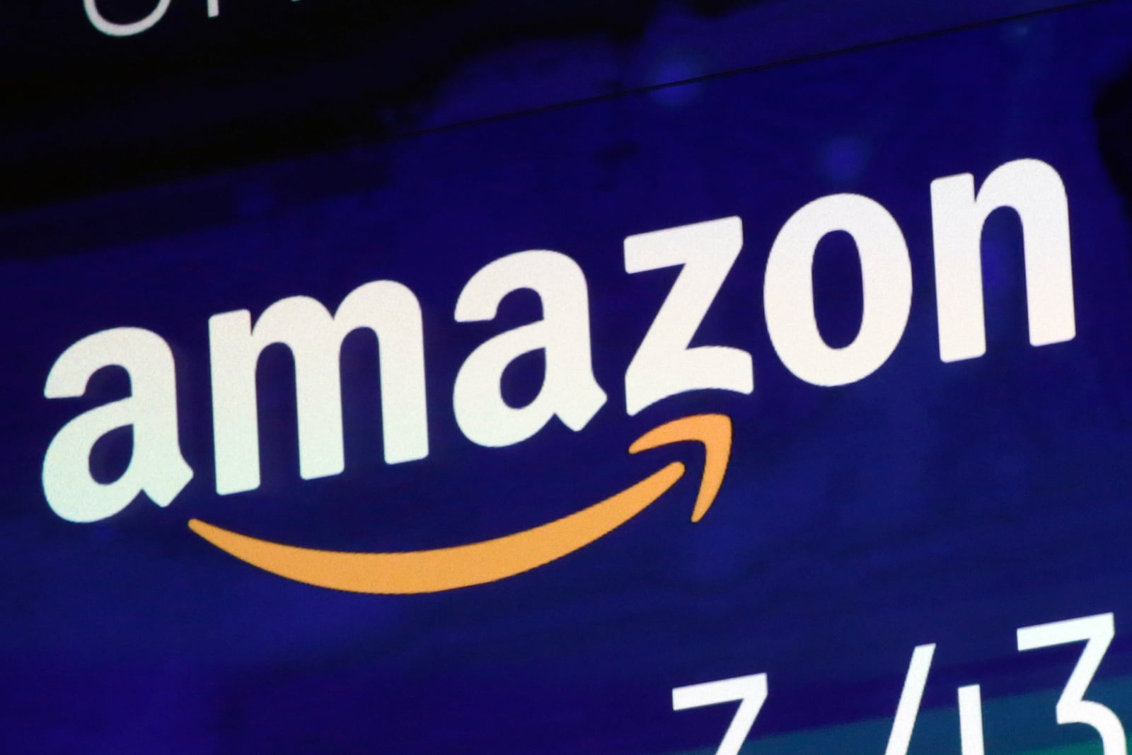 FILE - The logo for Amazon.com Inc. is displayed on a screen at the Nasdaq MarketSite, July 27, 2018. (AP Photo/Richard Drew, File)