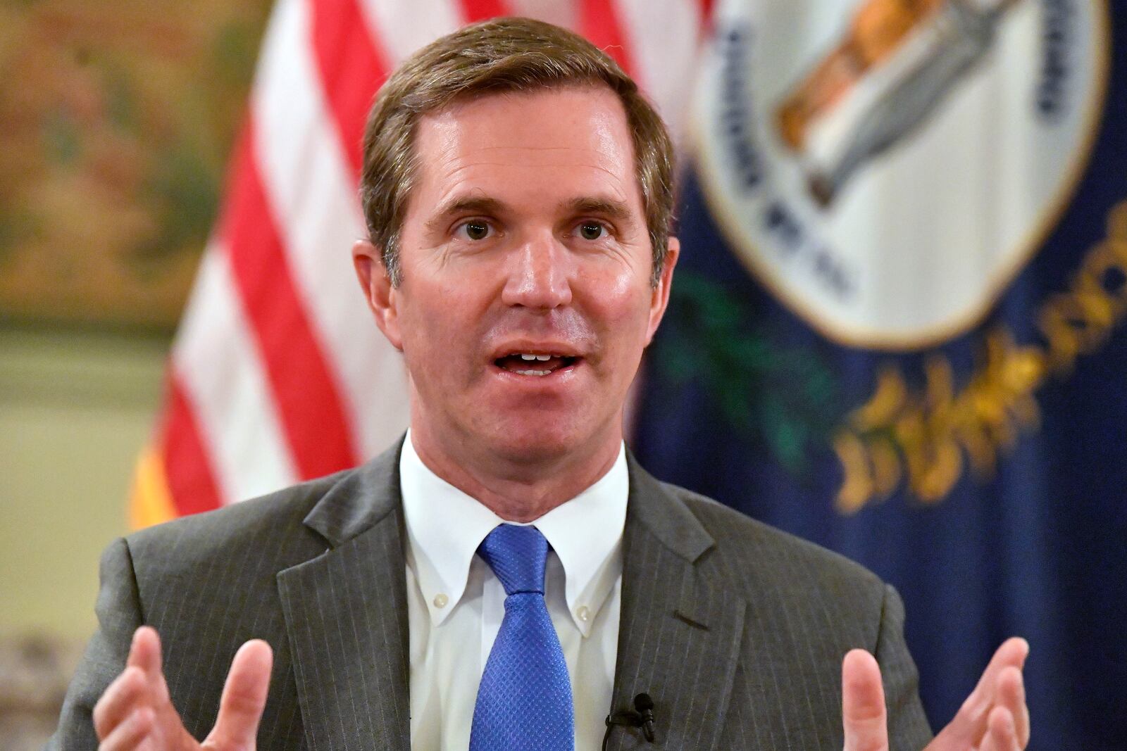 Kentucky Gov. Andy Beshear talks about the gains in the economic growth f the state during the past year in Frankfort, Ky., Wednesday, Dec. 18, 2024. (AP Photo/Timothy D. Easley)