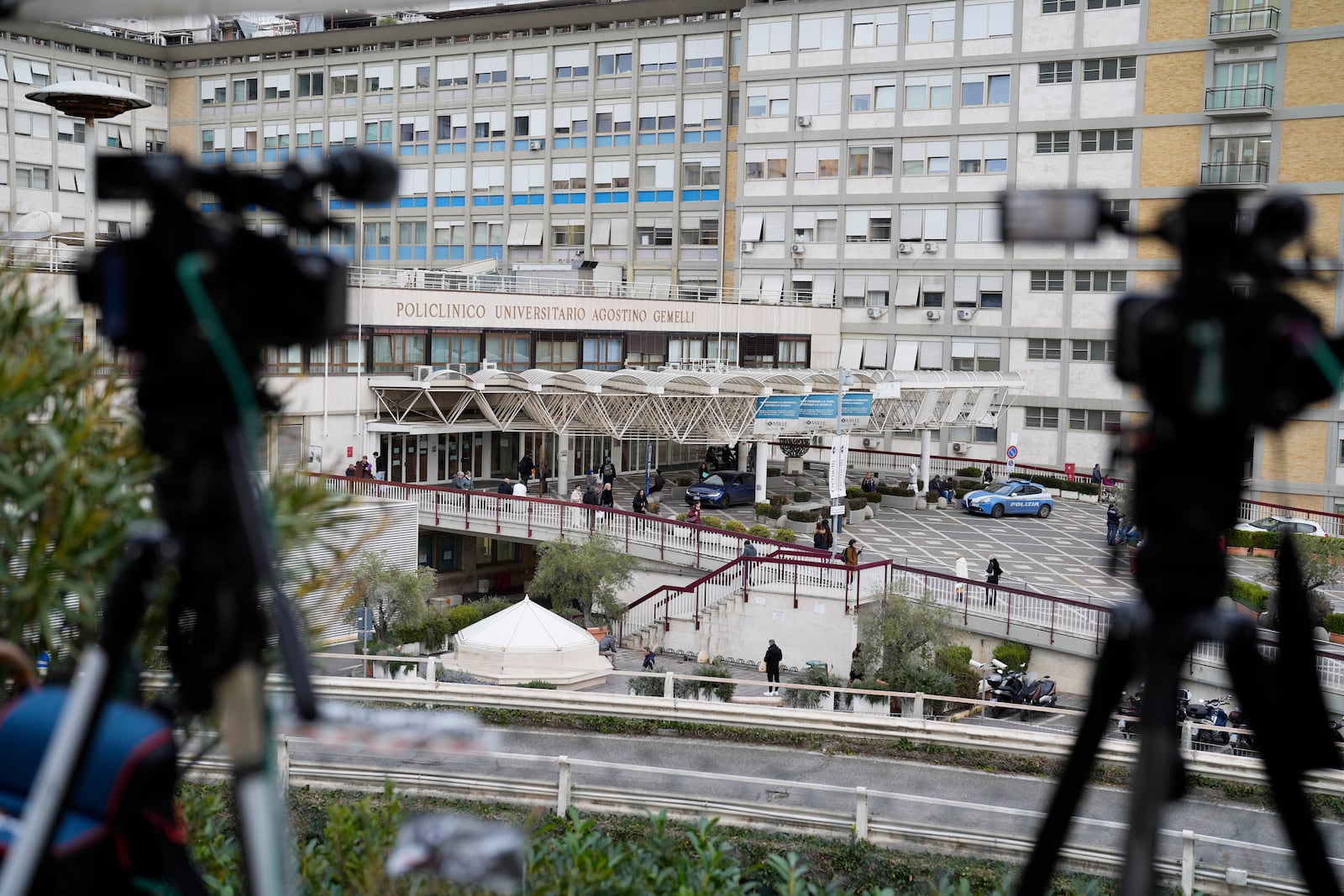 News tv cameras are set outside the Agostino Gemelli Polyclinic in Rome, Monday, Feb. 17, 2025, where Pope Francis was hospitalized Friday, Feb. 14, after a weeklong bout of bronchitis worsened and is receiving drug therapy for a respiratory tract infection. (AP Photo/Gregorio Borgia)