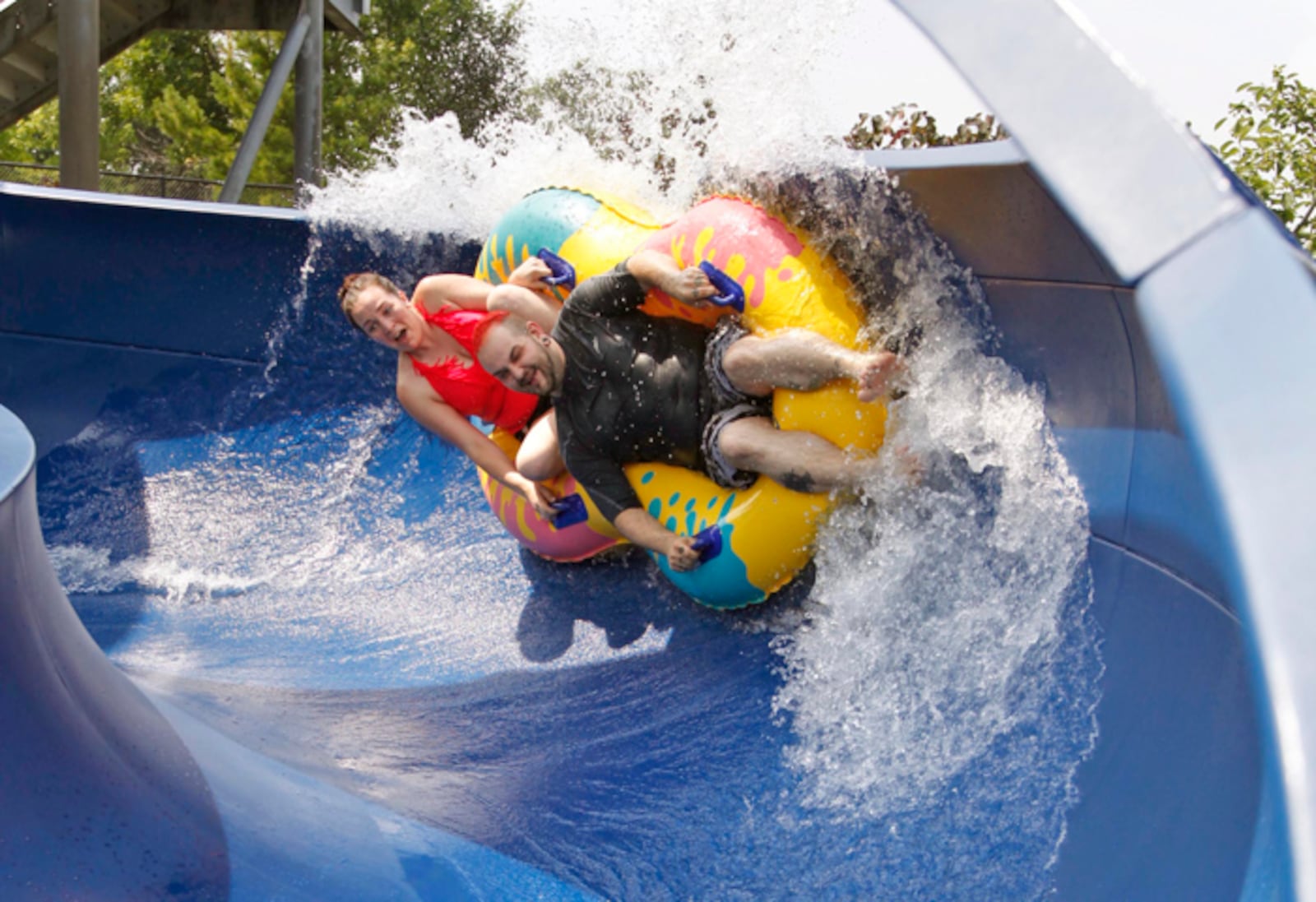 The Sycamore Trails Aquatic Center in Miamisburg includes many features, including a water slide. STAFF FILE PHOTO