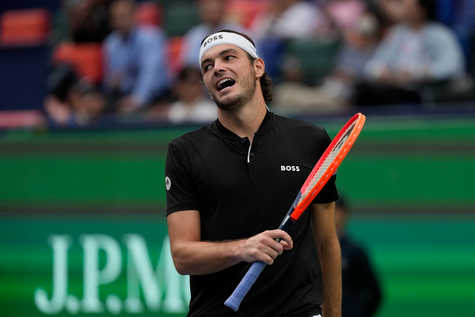 Taylor Fritz of the United States reacts during the men's singles quarterfinals match against David Goffin of Belgium in the Shanghai Masters tennis tournament at Qizhong Forest Sports City Tennis Center in Shanghai, China, Friday, Oct. 11, 2024. (AP Photo/Andy Wong)