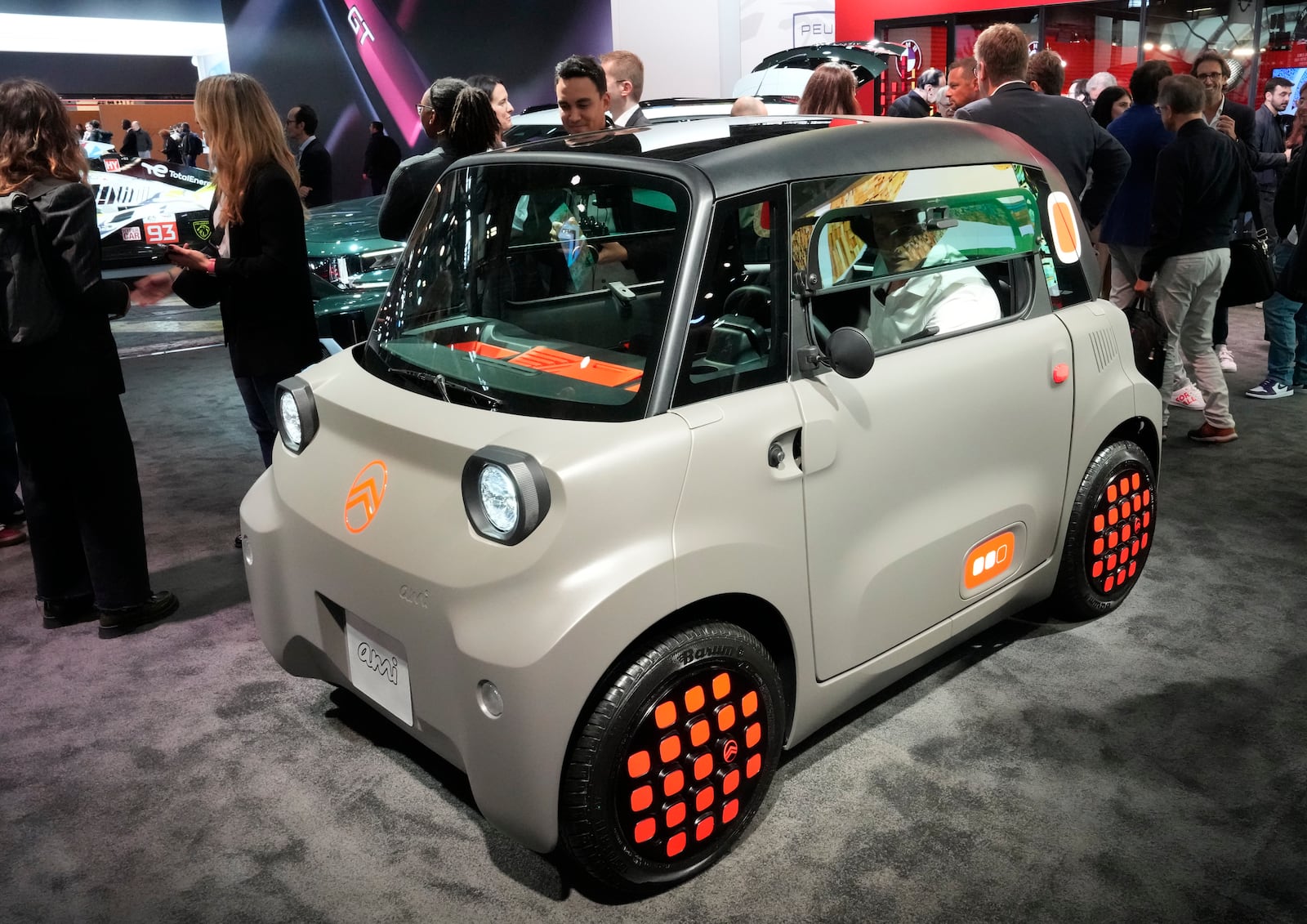 A Citroën Ami car is presented at the Paris Auto Show, in Paris, Monday, Oct. 14, 2024. (AP Photo/Michel Euler)