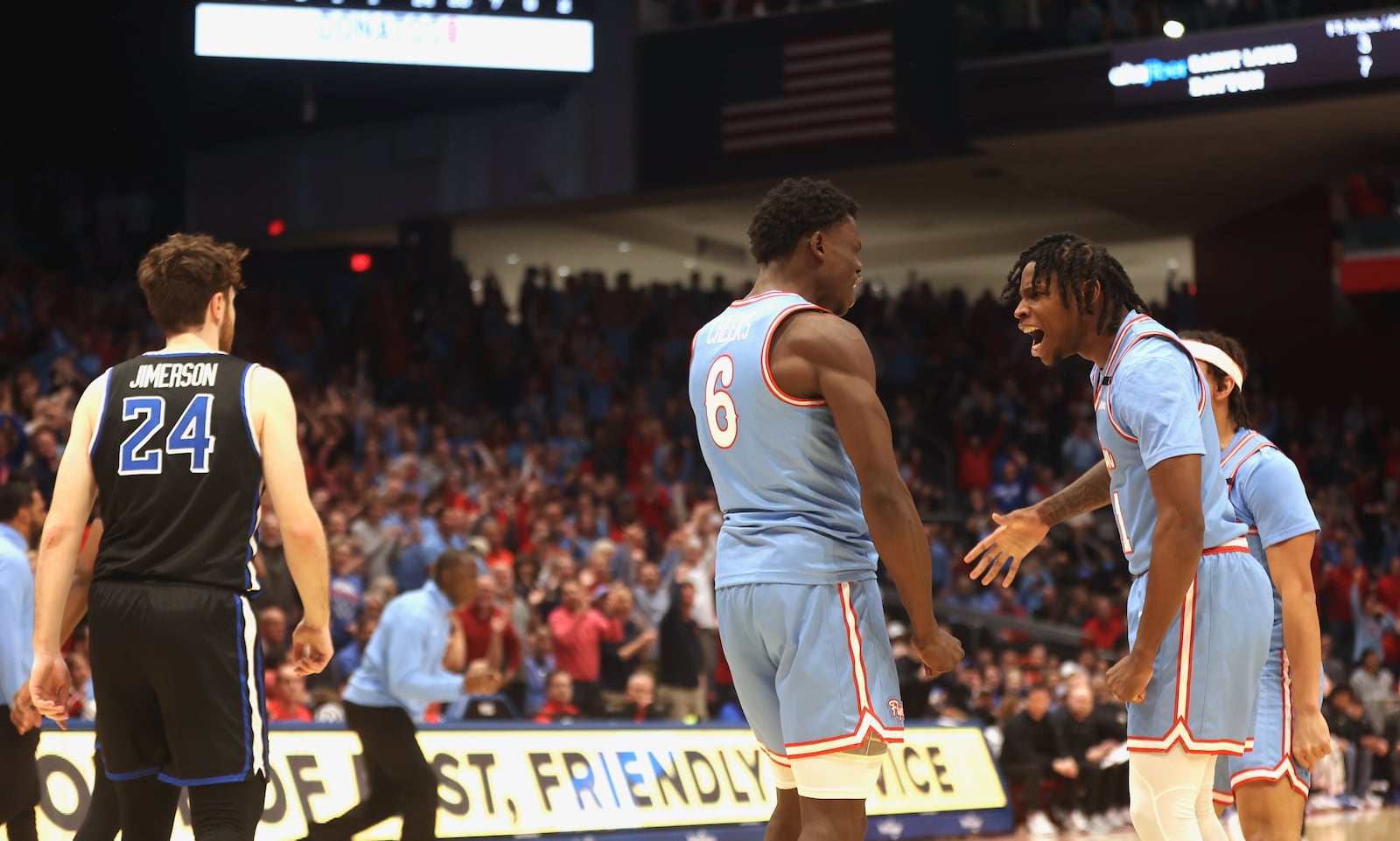 Dayton's Malachi Smith, right, and Enoch Cheeks celebrate after a basket in the second half against Saint Louis on Tuesday, March 4, 2025, at UD Arena. David Jablonski/Staff