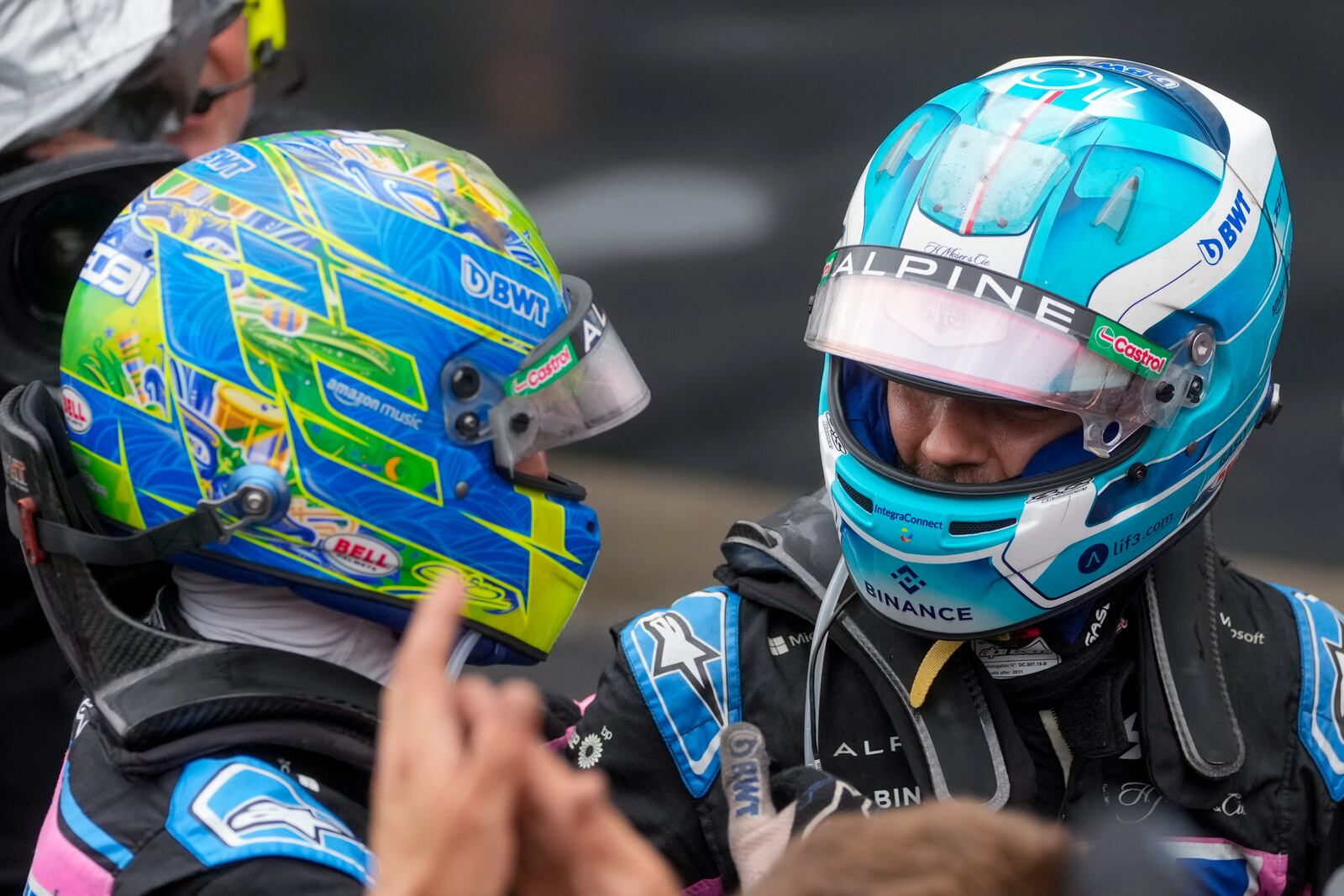 French Alpine drivers Esteban Ocon, left, and Pierre Gasly celebrate finishing second and third in the Brazilian Formula One Grand Prix at the Interlagos race track in Sao Paulo, Sunday, Nov. 3, 2024. (AP Photo/Andre Penner)