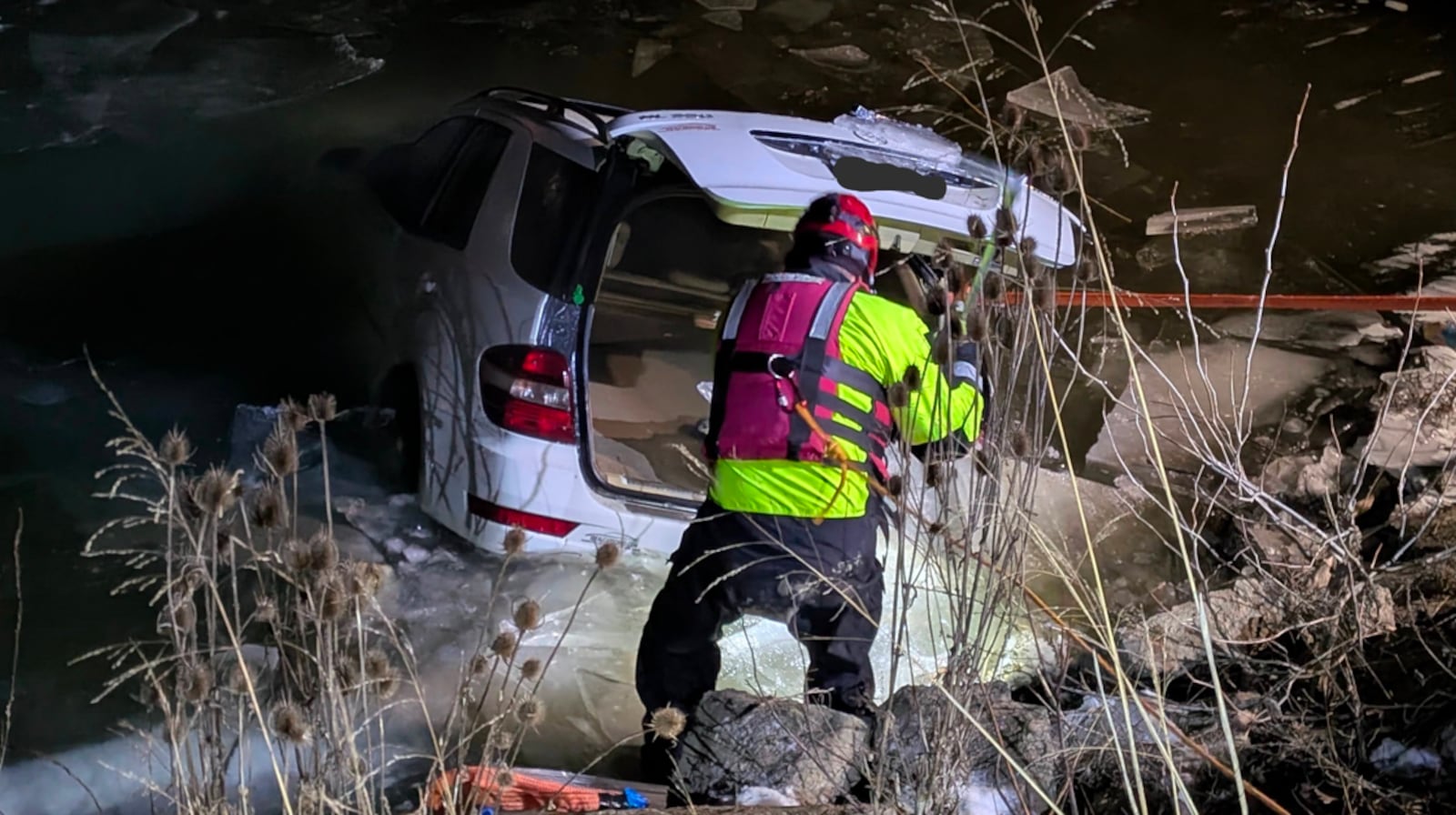 Emergency crews pull out an SUV found submerged in the Great Miami River. It's believed the car had been in the river since Friday, just south of the Columbia Road bridge. PROVIDED/BCSO