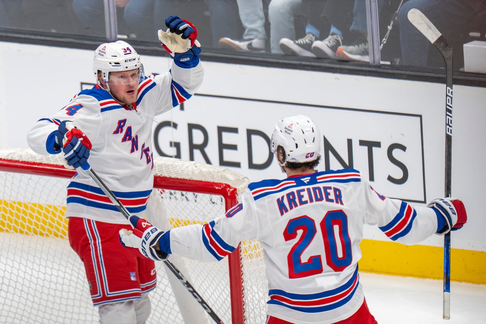 New York Rangers right wing Arthur Kaliyev and New York Rangers left wing Chris Kreider (20) celebrate Kaliyey's goal, during the first period of an NHL hockey game, Thursday, Jan. 16, 2025, in Salt Lake City. (AP Photo/Rick Egan)