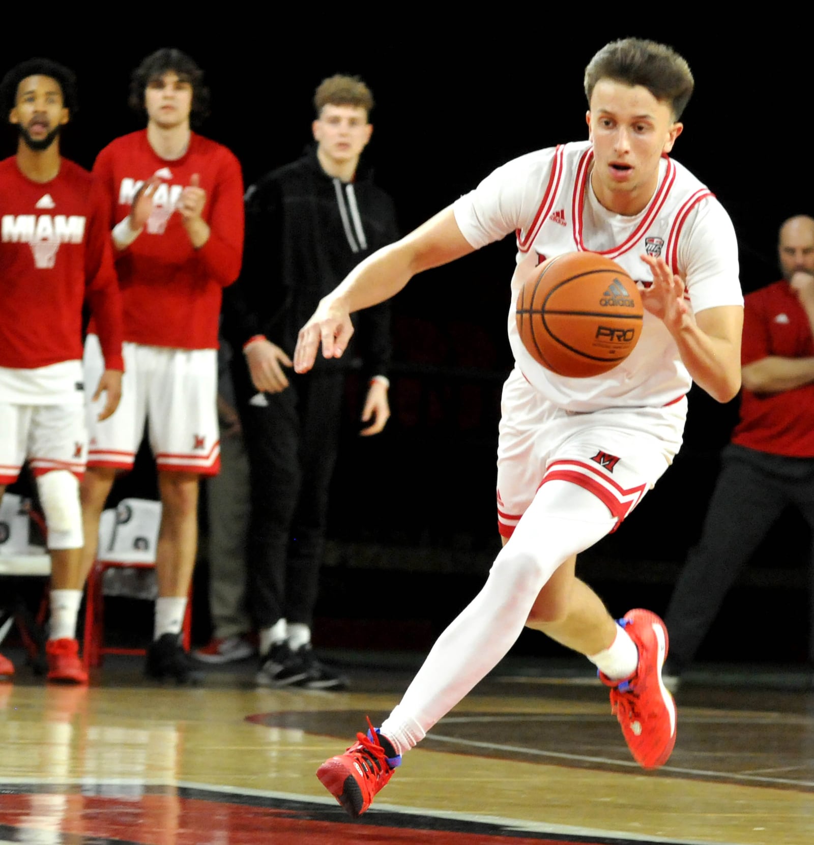 Miami's Ryan Mabrey, 13, brings the ball up court during the first half of a Mid American Conference game against Eastern Michigan at Millett Hall on Saturday, Jan. 28. DAVID A. MOODIE/CONTRIBUTING PHOTOGRAPHER