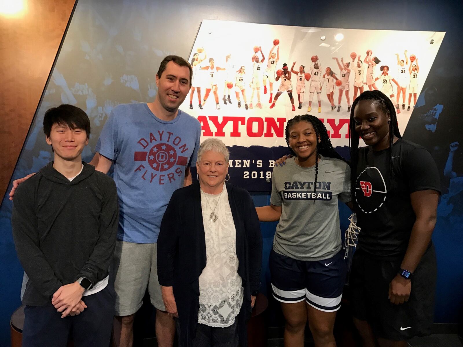 Linda Waltz and part of the UD women’s basketball staff in the Flyers’ offices last week.  (Left to right) Zachary Choo, grad assistant; Ryan Gensler, assistant coach; Linda Waltz, Maya Solomon, director of basketball operations; and Olivia Applegate, former UD player now a Flyers assistant coach. Tom Archdeacon/STAFF