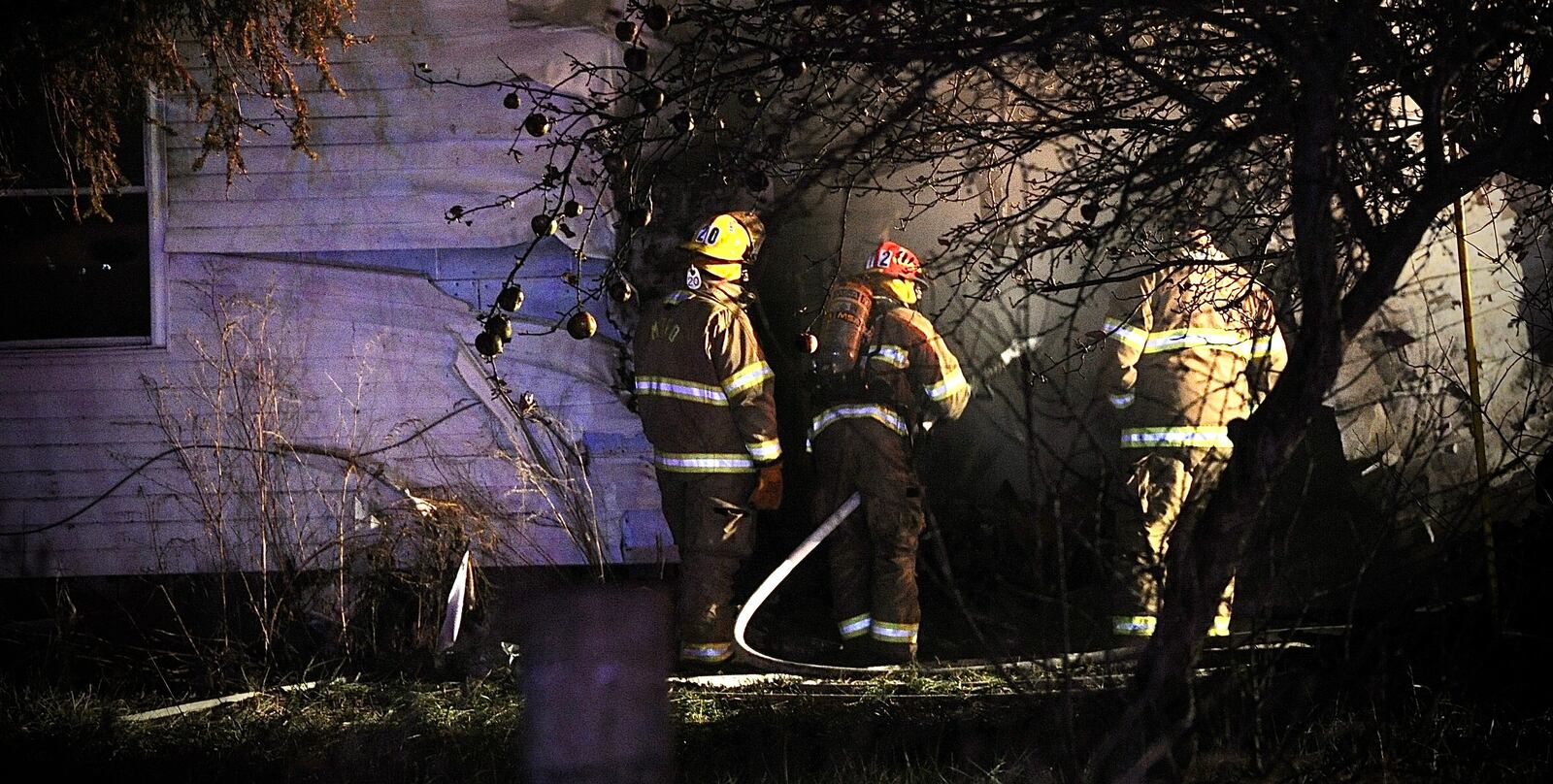 One person is dead after a car crashed into a house and both caught fire Wednesday evening, Dec. 8, 2021, in the 9900 block of state Route 235 in Champaign County on the border with Logan County. MARSHALL GORBY/STAFF