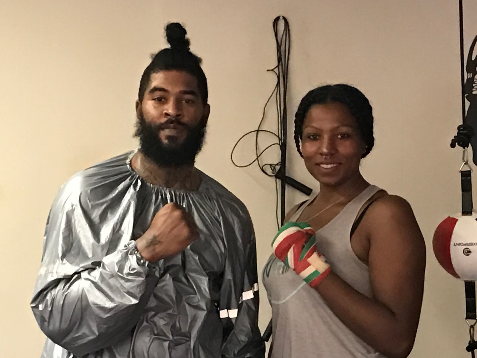 Chia Fei Asbury and her brother Chaen Chess before she begins a workout a few evenings ago in the King of Kingz gym in Cincinnati. “We’re the only brother and sister pro heavyweights around,” she said. A 42-year-old mother of three – a product of Belmont High and Sinclair Community College who now lives in Kettering – Asbury had three pro bouts on the road and her hometown debut is scheduled for October 19 in Trotwood. Her brother, a successful pro and talented amateur boxer, runs the gym and works her corner in fights. Tom Archdeacon/CONTRIBUTED