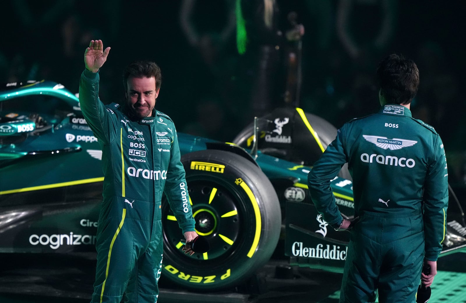 Aston Martin drivers Fernando Alonso, l,eft, and Lance Stroll, right, during the F1 75 Live event at the O2 arena in London, England, Tuesday, Feb. 18, 2025.(Bradley Collyer/PA via AP)