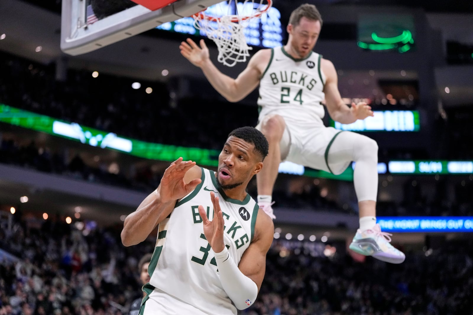 Milwaukee Bucks' Giannis Antetokounmpo reacts after Pat Connaughton dunks during the second half of an NBA basketball game against the Brooklyn Nets Thursday, Jan. 2, 2025, in Milwaukee. (AP Photo/Morry Gash)