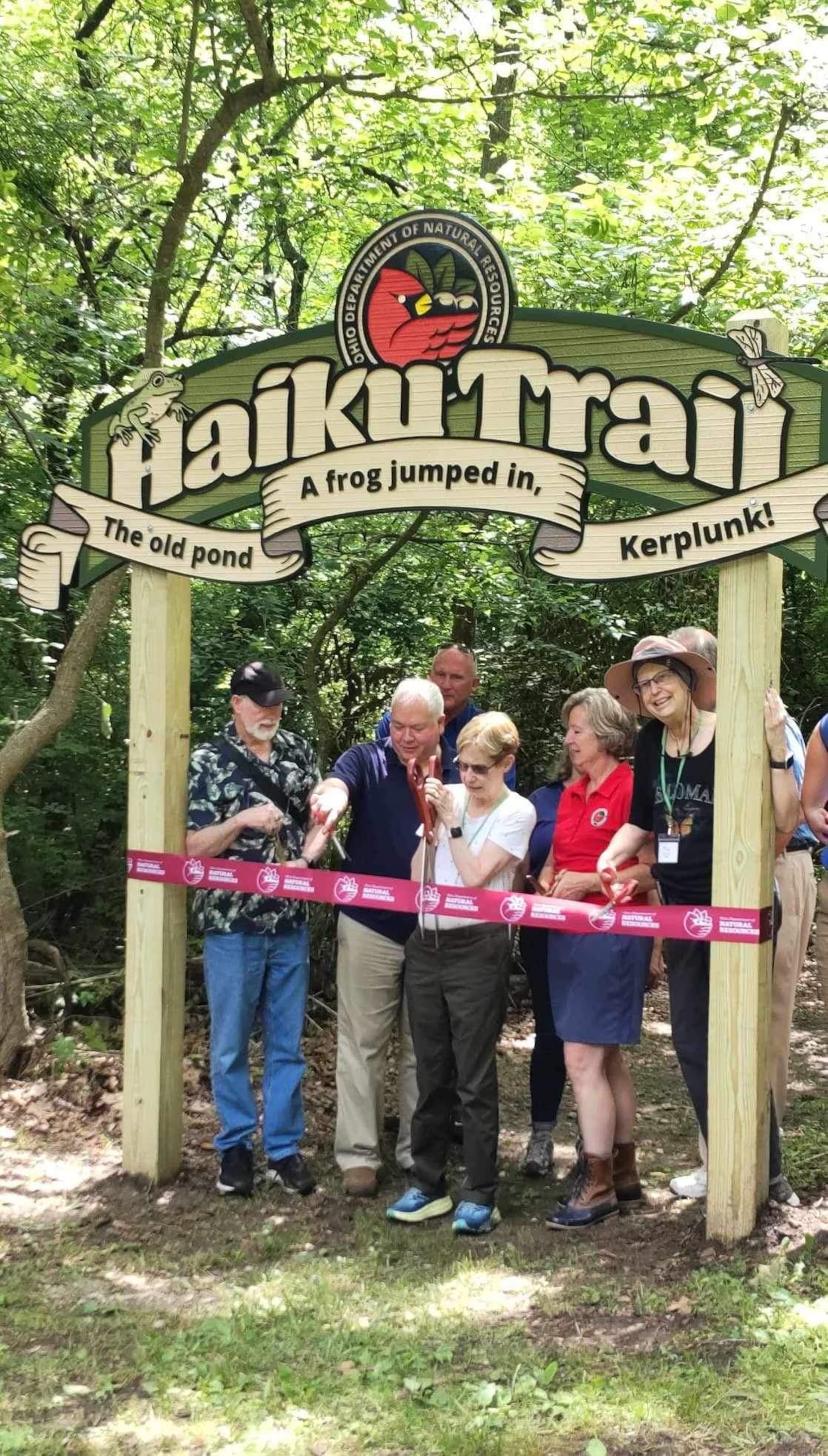 Patti Niehoff (center), a member of Haiku North America, donated to make the Hueston Woods Haiku Trail possible.