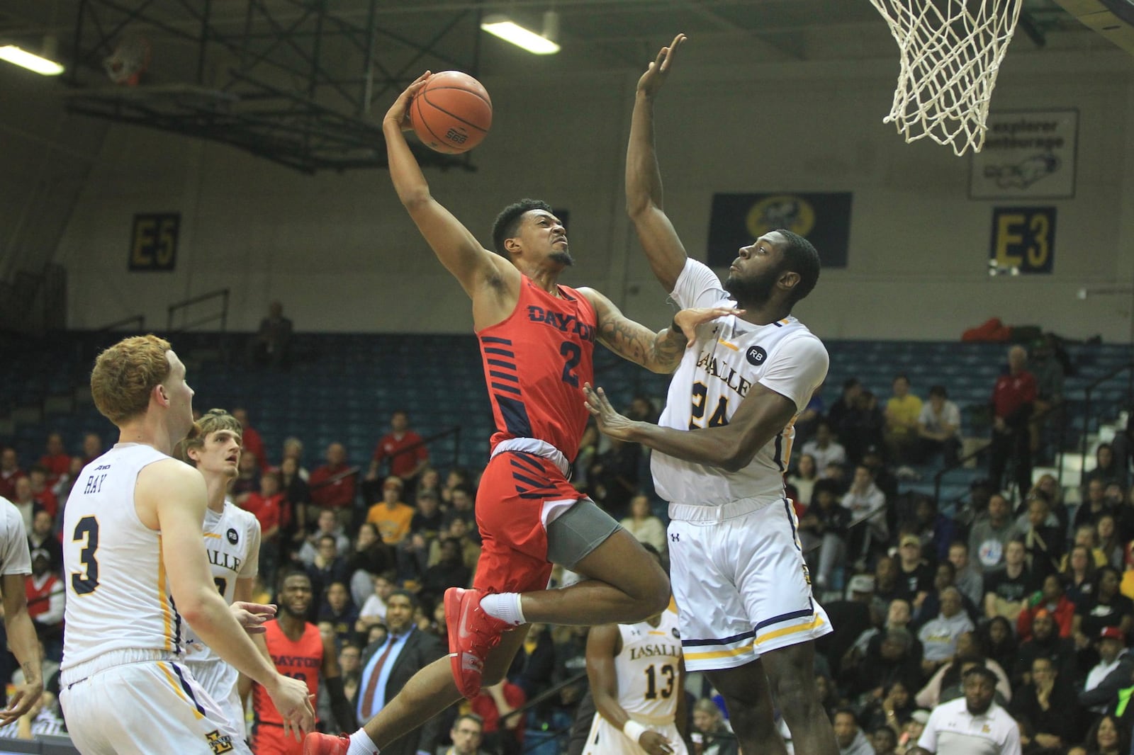 Dayton’s Ibi Watson tries to dunk at the end of the first half against La Salle on Thursday, Jan. 2, 2020, at Tom Gola Arena in Philadelphia. David Jablonski/Staff