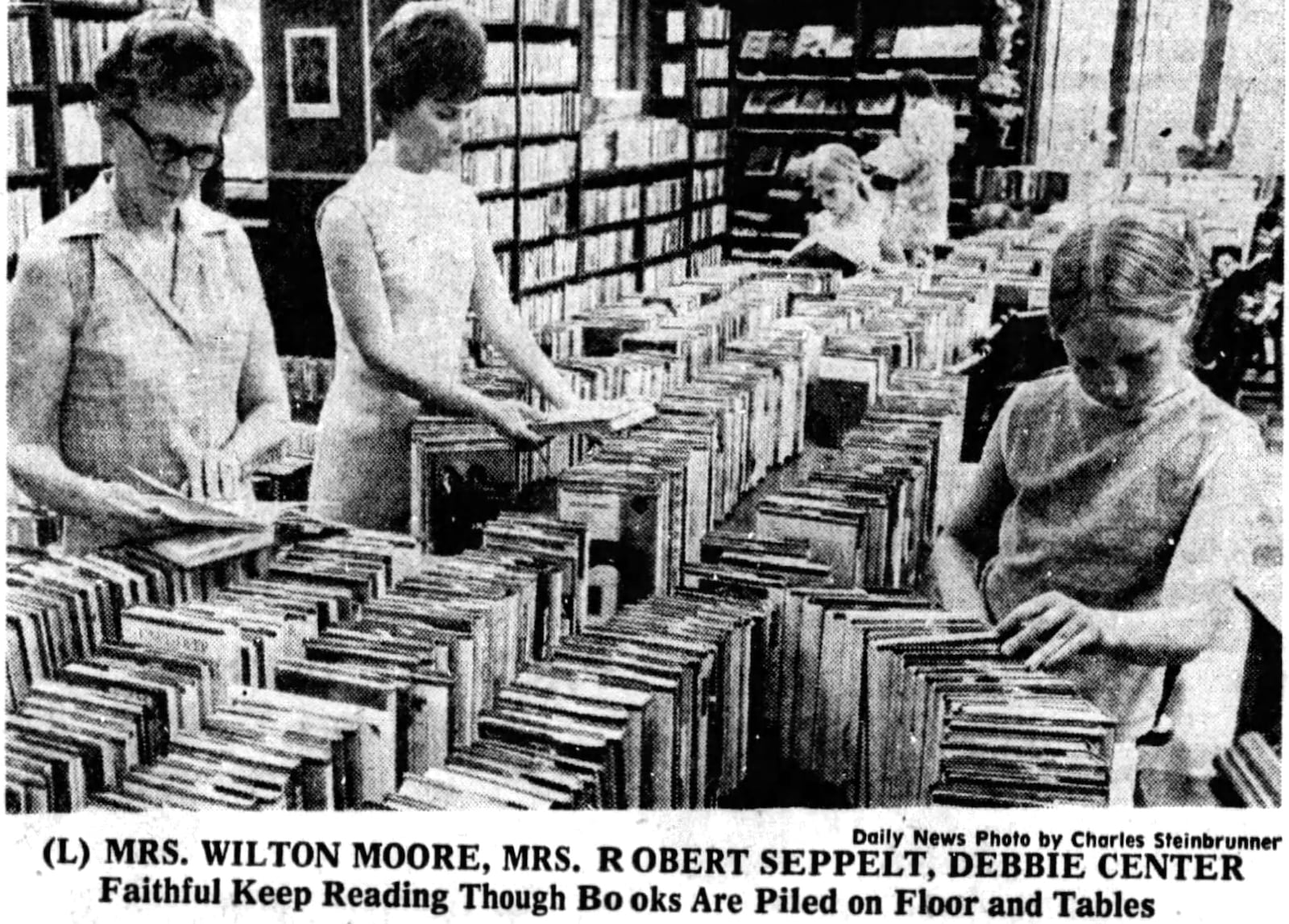 Faithful readers sort through books piled on tables during a renovation project at the Wright Library in 1971. DAYTON DAILY NEWS ARCHIVES