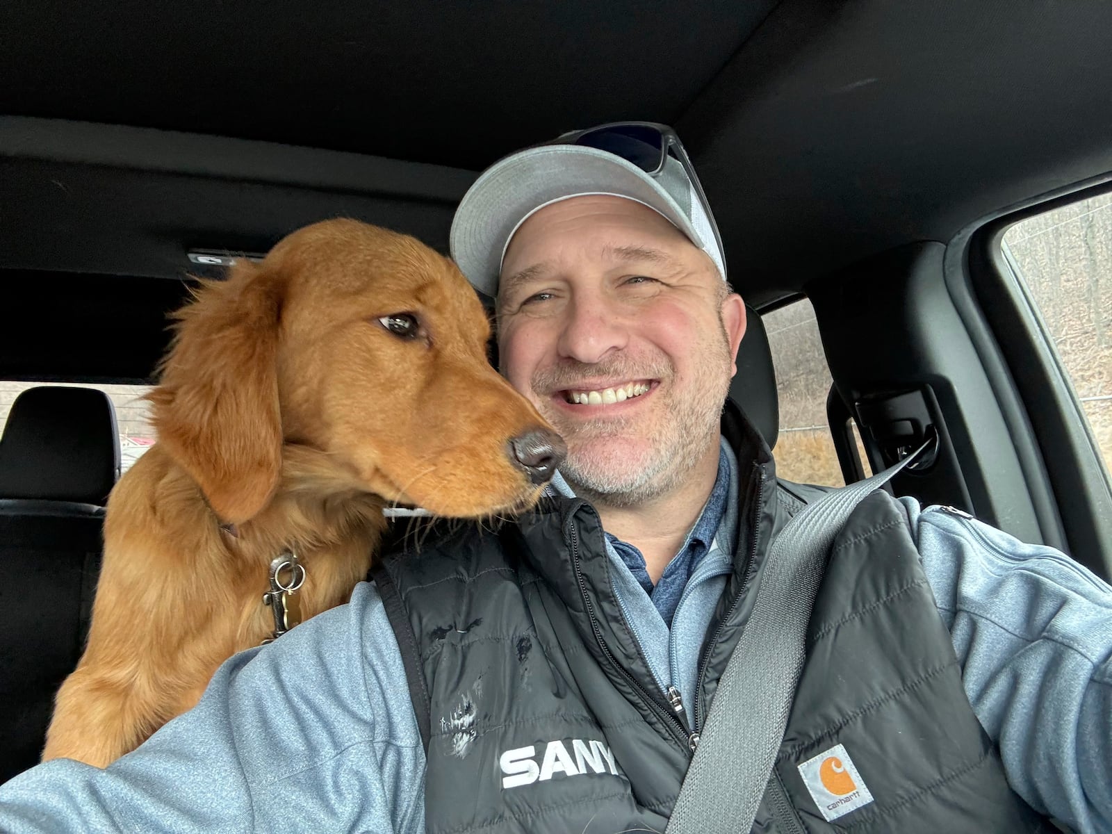 In this Feb. 2025 photo provided by Pam Palko, shown is Joe Palko after he was reunited with his six-month-old Golden retriever pup named Freddy, a week after the dog ran off from his home at the base of Sharp Mountain in Pottsville, Pa. (Joe Palko via AP)