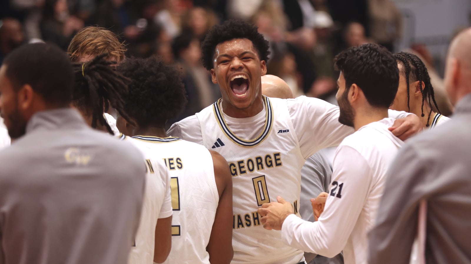 George Washington's Trey Autry celebrates with teammates after a victory against Dayton on Saturday, Jan. 4, 2025, at the Charles E. Smith Center in Washington, D.C. David Jablonski/Staff