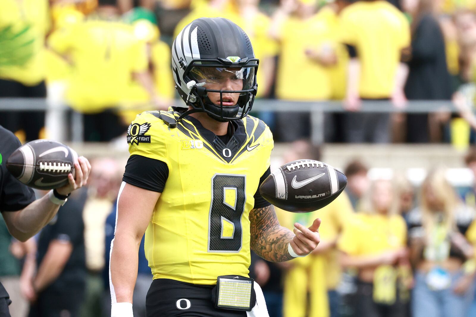 Oregon quarterback Dillon Gabriel warms up before an NCAA college football game against Illinois, Saturday, Oct. 26, 2024, in Eugene, Ore. (AP Photo/Lydia Ely)