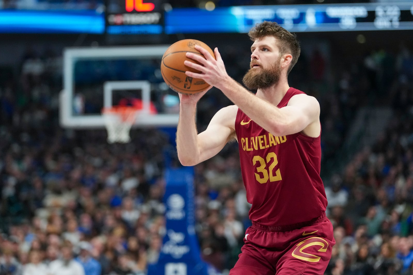 Cleveland Cavaliers forward Dean Wade prepares to shoot against the Dallas Mavericks during the first half of an NBA basketball game, Friday, Jan. 3, 2025, in Dallas. (AP Photo/Julio Cortez)