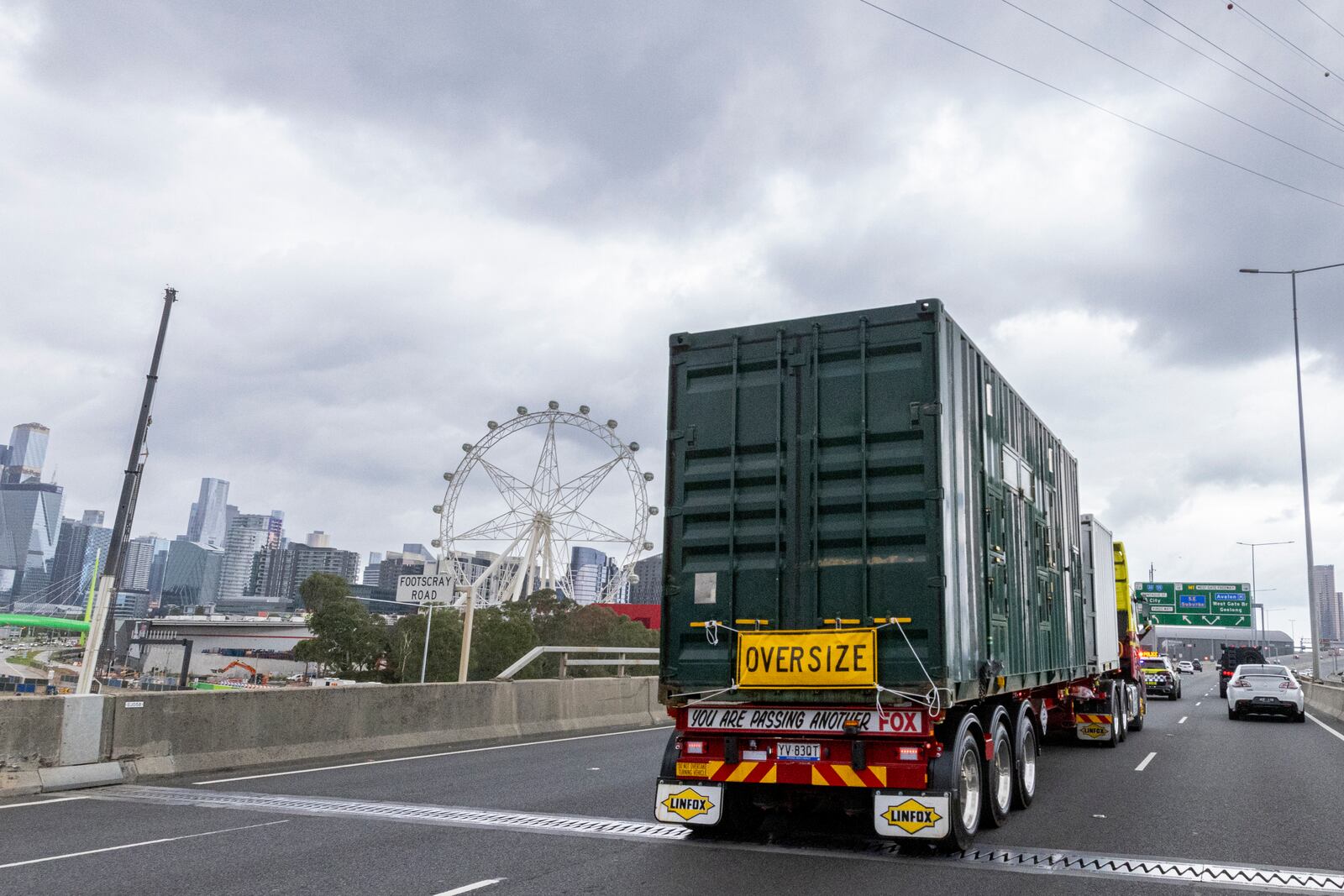 In this photo provided by Zoos Victoria on Thursday, Feb. 13, 2025, elephants loaded in shipping containers are driven through Melbourne, Australia, as part of a program to move a herd of Asian elephants from Melbourne Zoo to Werribee Open Range Zoo. (Jo Howell/Zoos Victoria via AP)