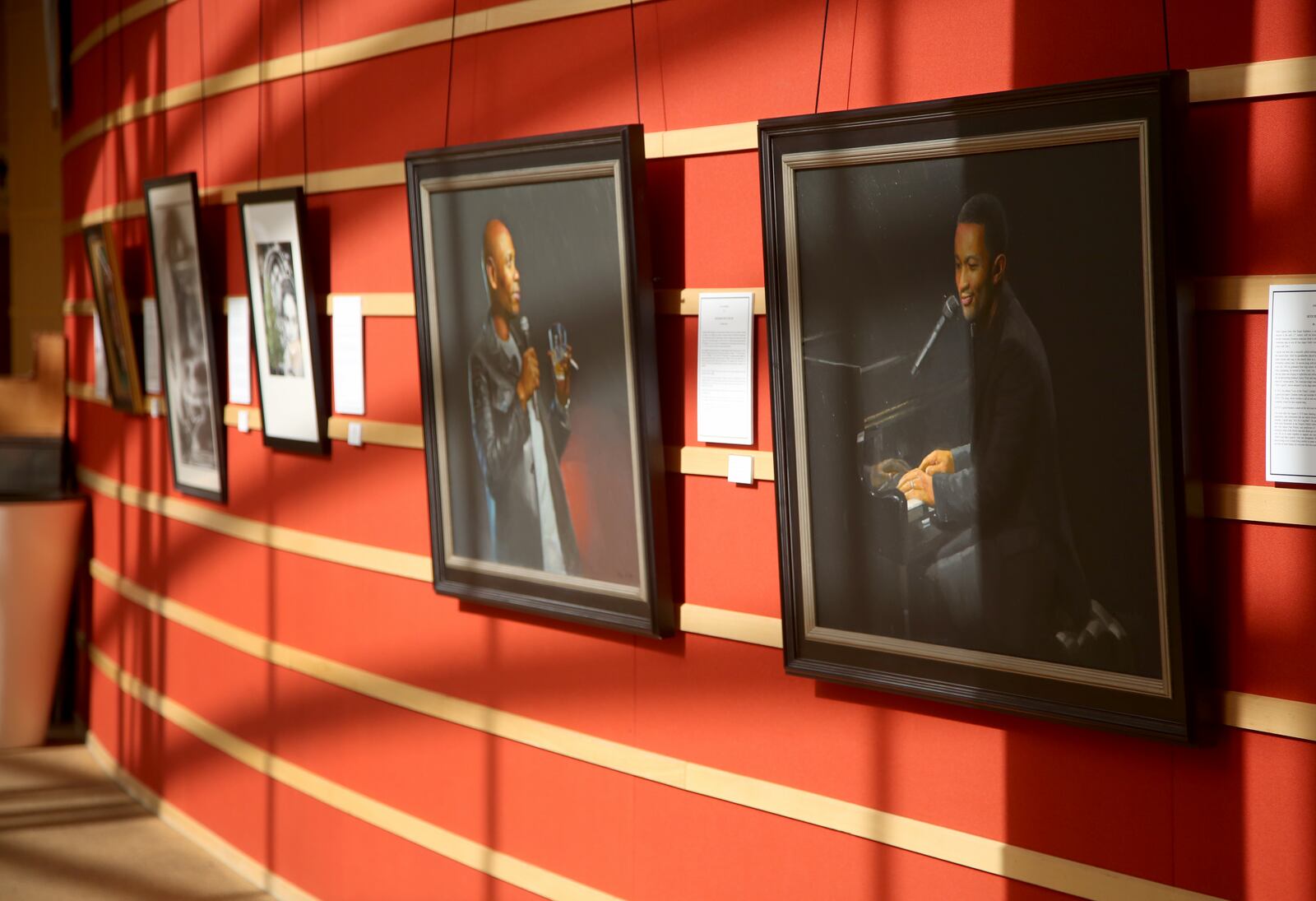 Painting by artist Abner Cope of Dave Chappelle and John Legend are part of the Dayton Skyscrapers 2020 Visual Voices art exhibit. LISA POWELL / STAFF