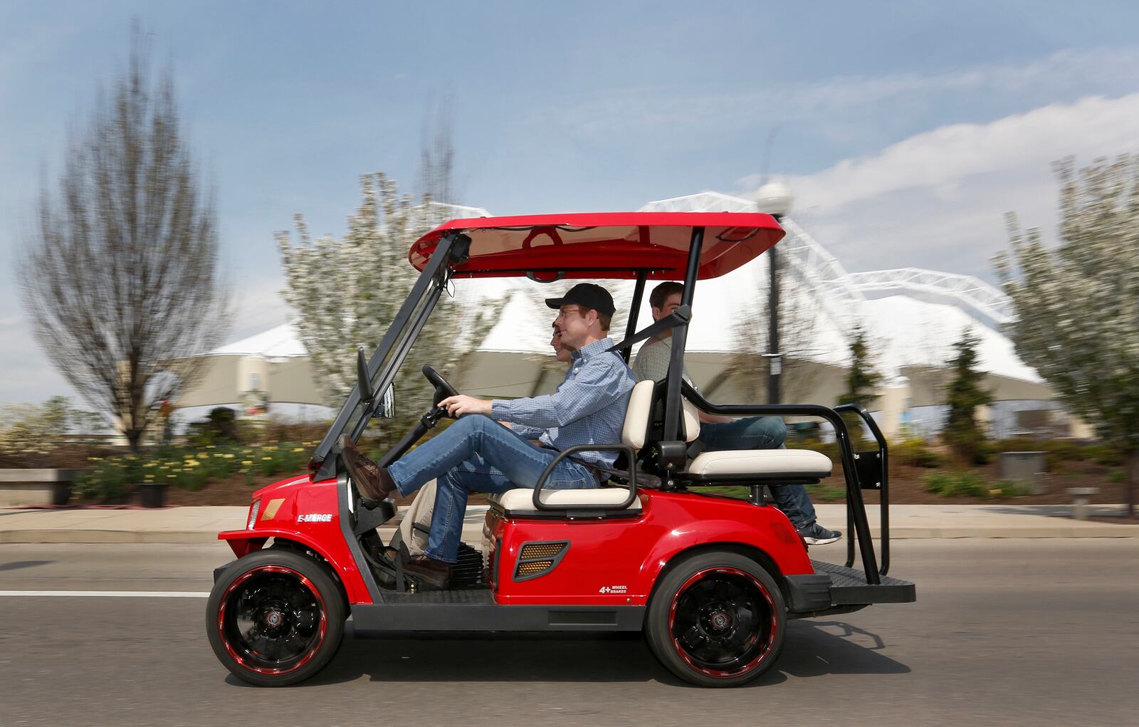 John Meixner of Bellbrook and his sons Aaron, 15, and Alex, 14, have started Touring Carts, a new business that will provide golf cart tours of Dayton. Meixner said he wanted his children to experience what it takes to start a business, so the trio brainstormed the idea.  LISA POWELL / STAFF