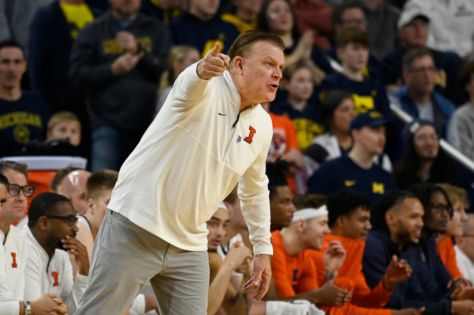 Illinois head coach Brad Underwood yells toward the court during the first half of an NCAA college basketball game against Michigan, Sunday, March 2, 2025, in Ann Arbor, Mich. (AP Photo/Jose Juarez)