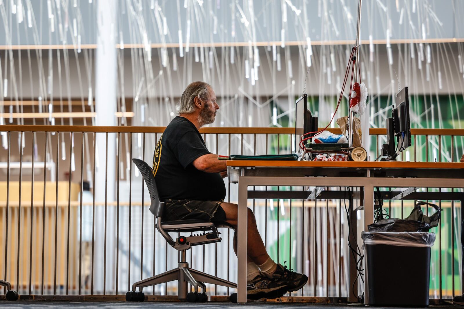 George J. Rocheleau, from Beavercreek, is working on a book at the Dayton Public Library about his cousin who served in WWll. The library is in line to get more money from the public library fund in 2023 than it did has this year. JIM NOELKER/STAFF