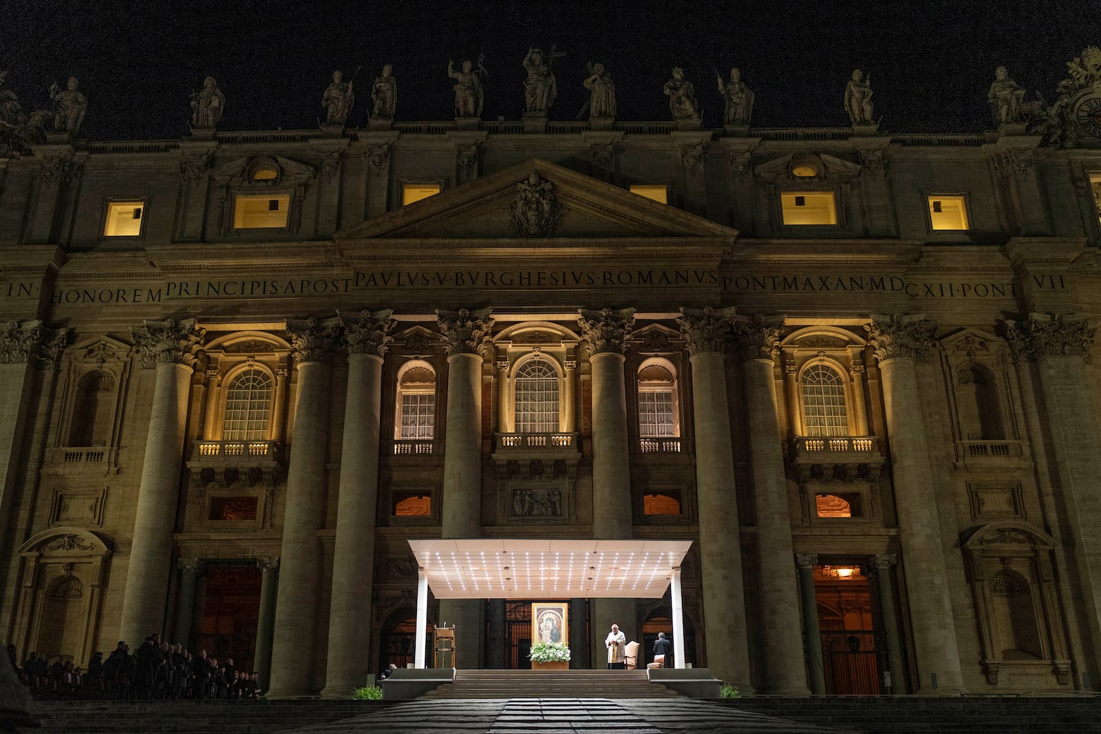 Cardinal Konrad Krajewski, Almsman of His Holiness, leads a nightly rosary prayer for the health of Pope Francis in St. Peter's Square at the Vatican, Sunday, March 2, 2025. (AP Photo/Mosa'ab Elshamy)