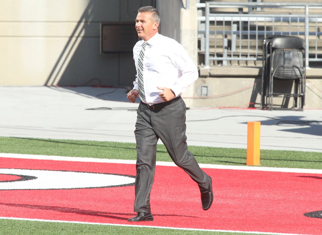 Photos: Urban Meyer jogs across field at Ohio Stadium