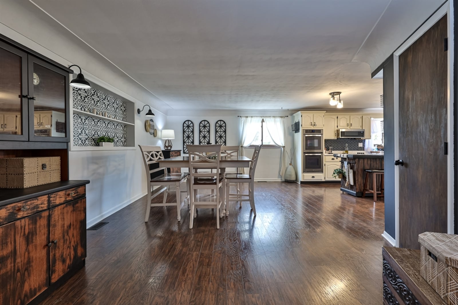 Off the foyer to the left, the floor plan was opened into a spacious kitchen and flexible space room with dining area.