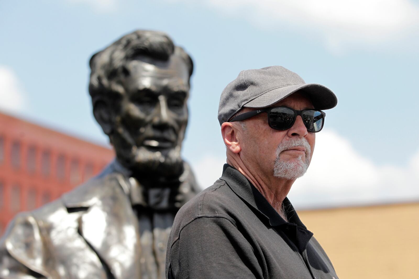 A 1,700-pound bronze sculpture of Abraham Lincoln created by Urbana artist Mike Major (pictured) was delivered to Dayton Tuesday. The statue will be placed in a park at the Dayton VA Medical Center campus in the fall.  LISA POWELL / STAFF