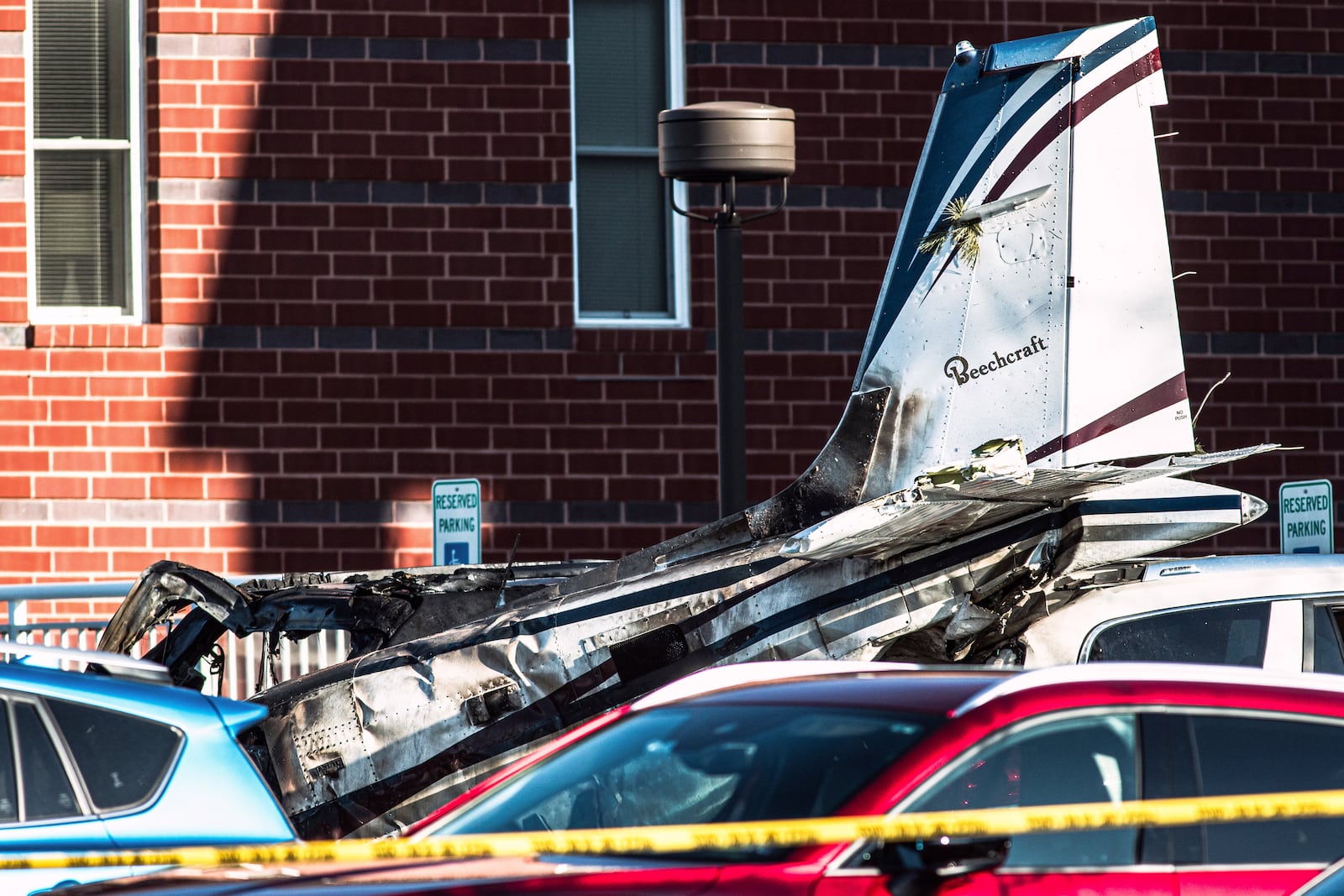 Debris is seen after a plane crashed in a parking lot of a retirement community Sunday, March 9, 2025, in Manheim Township, Pa. (Zach Gleiter/The Patriot-News via AP)