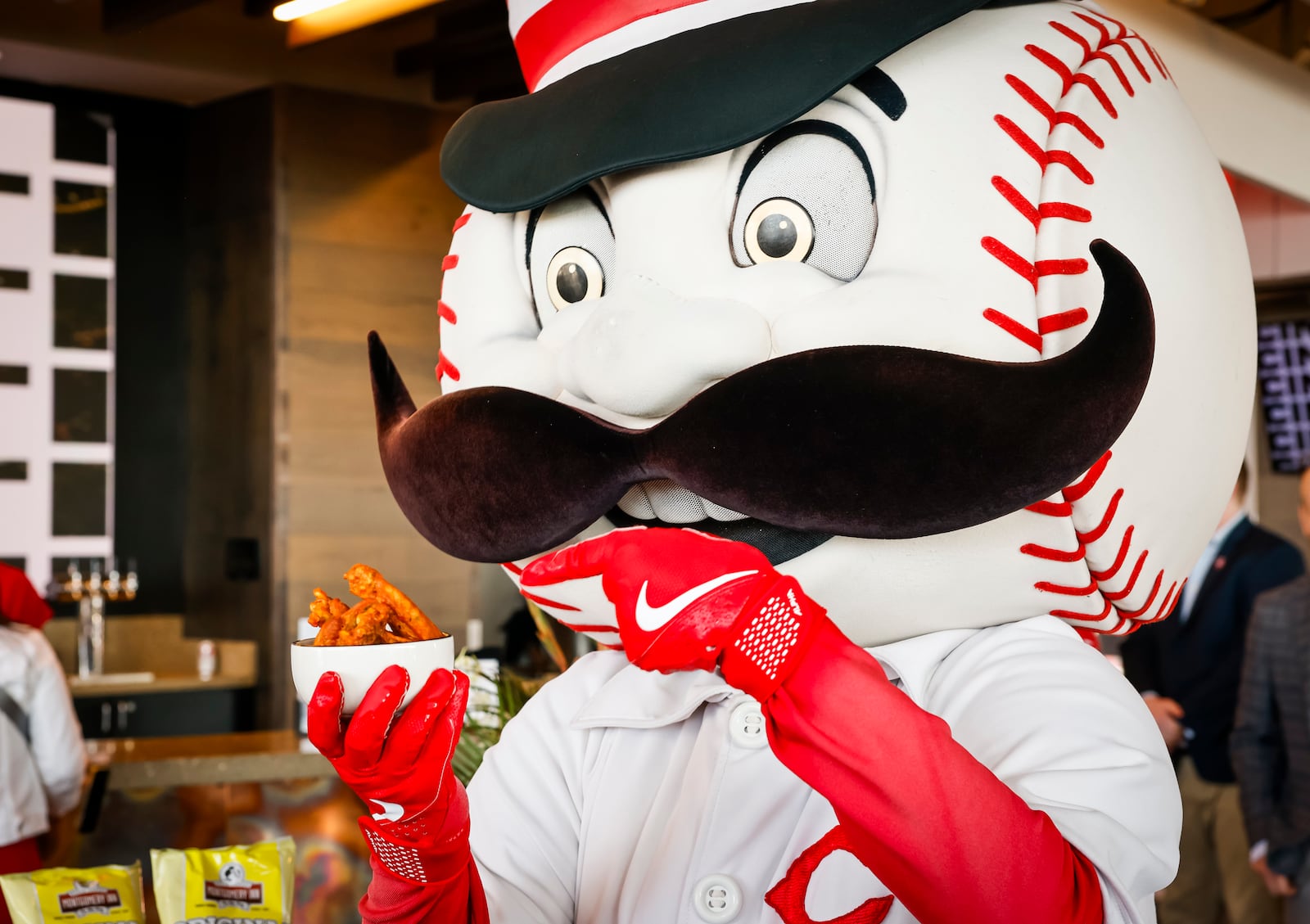 The Cincinnati Reds announced new menu items ahead of opening day on Friday, March 21, 2025 in The Handlebar at the Riverfront Club inside Great American Ball Park in Cincinnati. Executive Chef Gary Davis created a variety of new dishes for the upcoming season. Macots Mr. Redlegs and Rosie Red were working the crowd during the event. NICK GRAHAM/STAFF