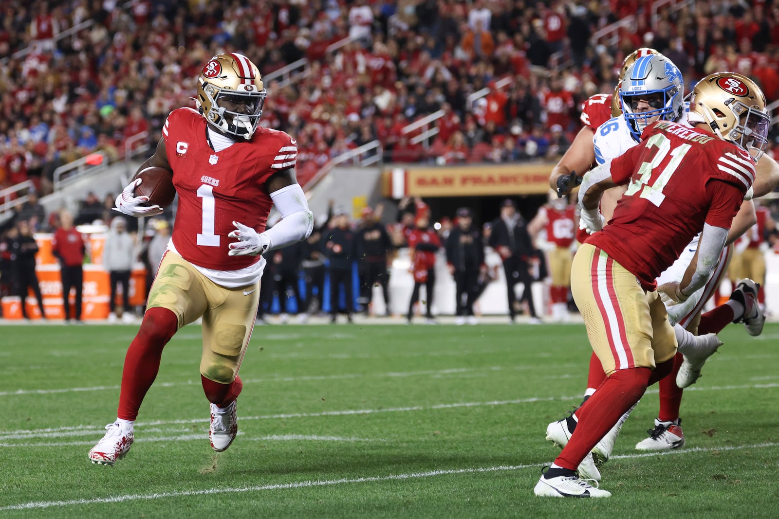 San Francisco 49ers wide receiver Deebo Samuel Sr. (1) scores a touchdown during the second half of an NFL football game against the Detroit Lions, Monday, Dec. 30, 2024, in Santa Clara, Calif. (AP Photo/Jed Jacobsohn)