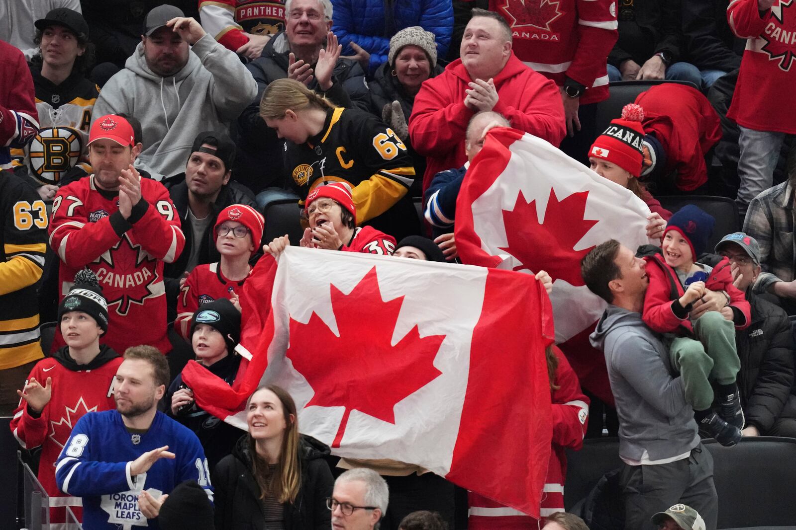 Canada fans celebrate during the first period of a 4 Nations Face-Off hockey game against Finland, Monday, Feb. 17, 2025, in Boston. (AP Photo/Charles Krupa)