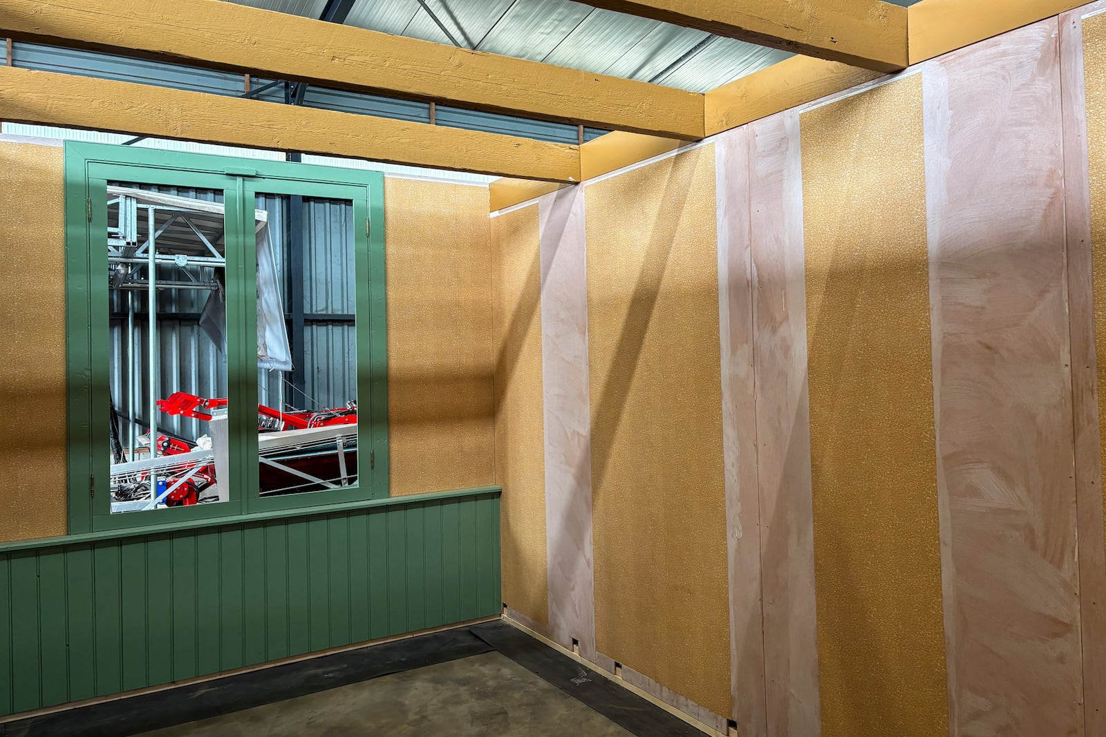 Wallpaper is being prepared for an exact replica of the secret annex which will travel to New York for an exhibit, in the village of Erp, southern Netherlands, Thursday, Oct. 10, 2024. (AP Photo/Aleksandar Furtula)