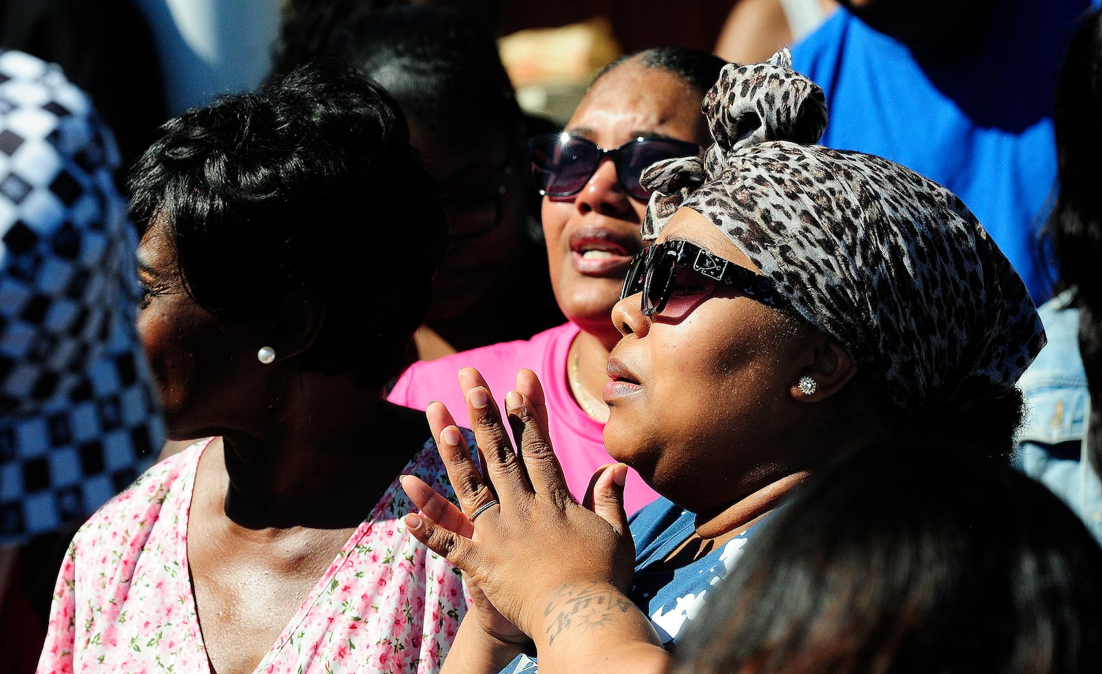 Friends and family member all prayed together Sunday, June 30, 2024 as balloons were released in honor of a teen who was shot and killed by Dayton Police.  MARSHALL GORBY\STAFF