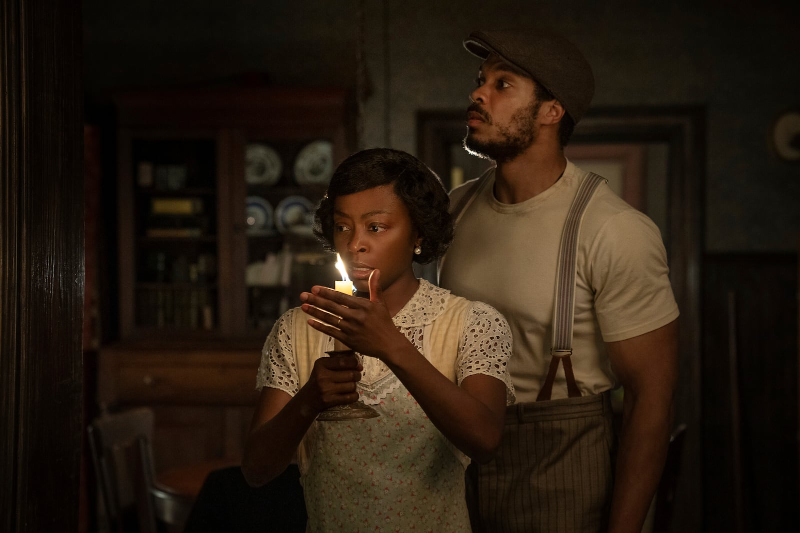 This image released by Netflix shows Danielle Deadwyler, left, and Ray Fisher in a scene from "The Piano Lesson." (David Lee/Netflix via AP)