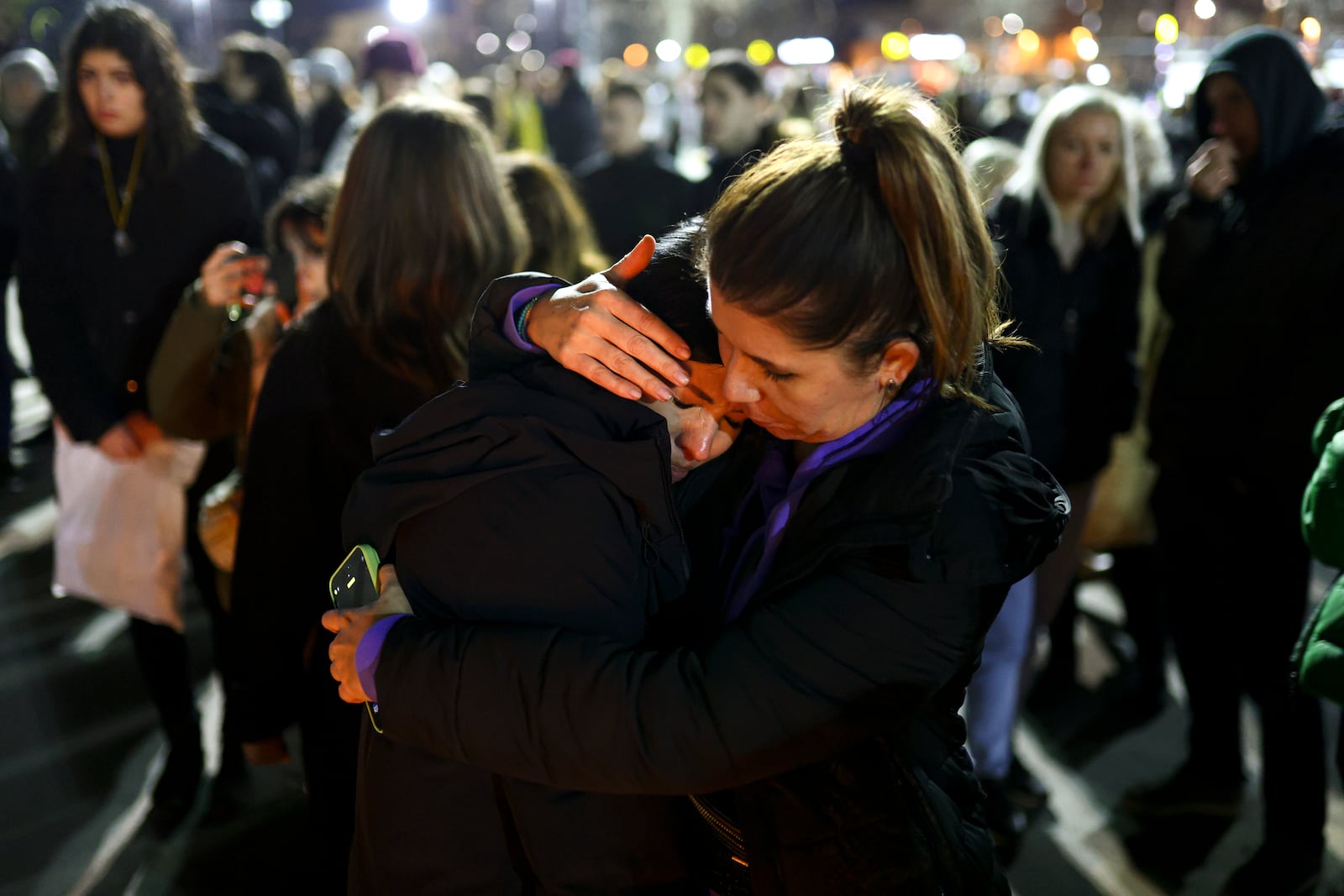 A woman cries at the site of the collapse of a concrete canopy that killed 15 people more than two months ago, during a protest in Novi Sad, Serbia, Friday, Jan. 31, 2025. (AP Photo/Armin Durgut)