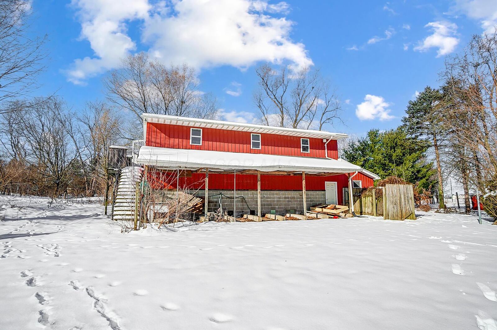 The property also has a barn with garage doors and two levels.