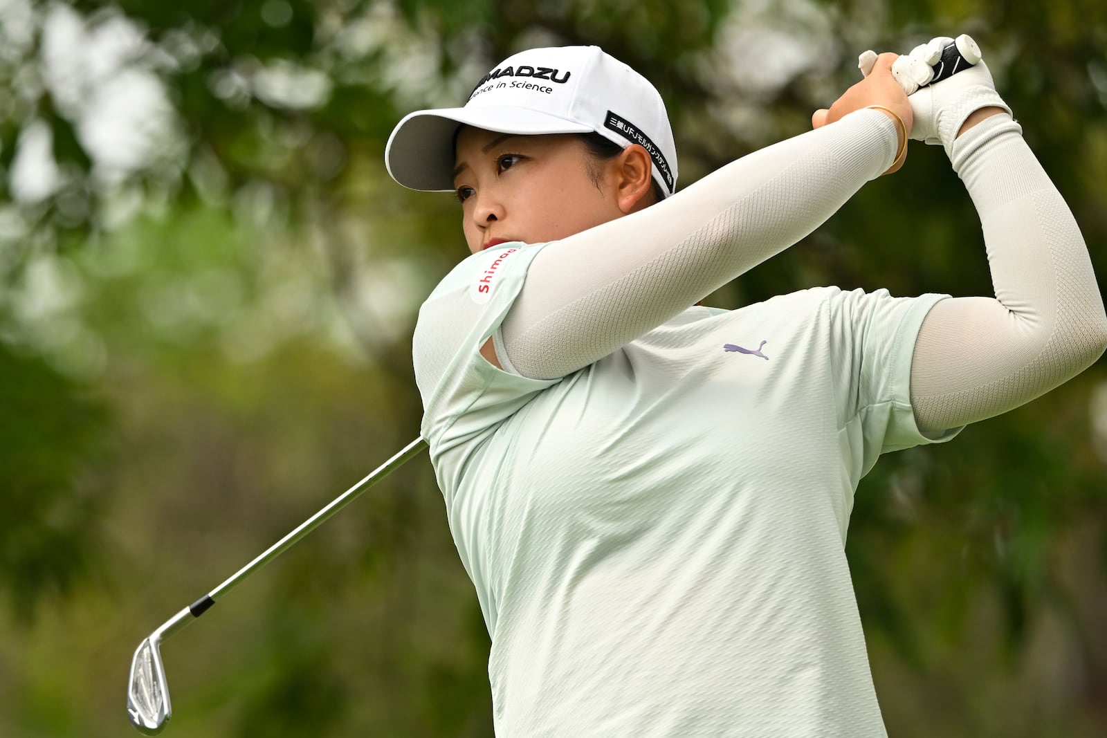 Mao Saigo of Japan hits a tee shot on the first hole of the LPGA Honda Thailand golf tournament in Pattaya, southern Thailand, Thursday, Feb. 20, 2025. (AP Photo/Kittinun Rodsupan)