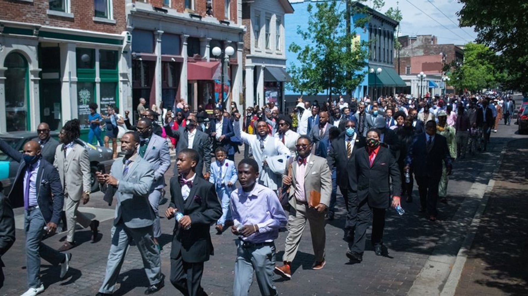 Photos: 300 men in suits march in Dayton