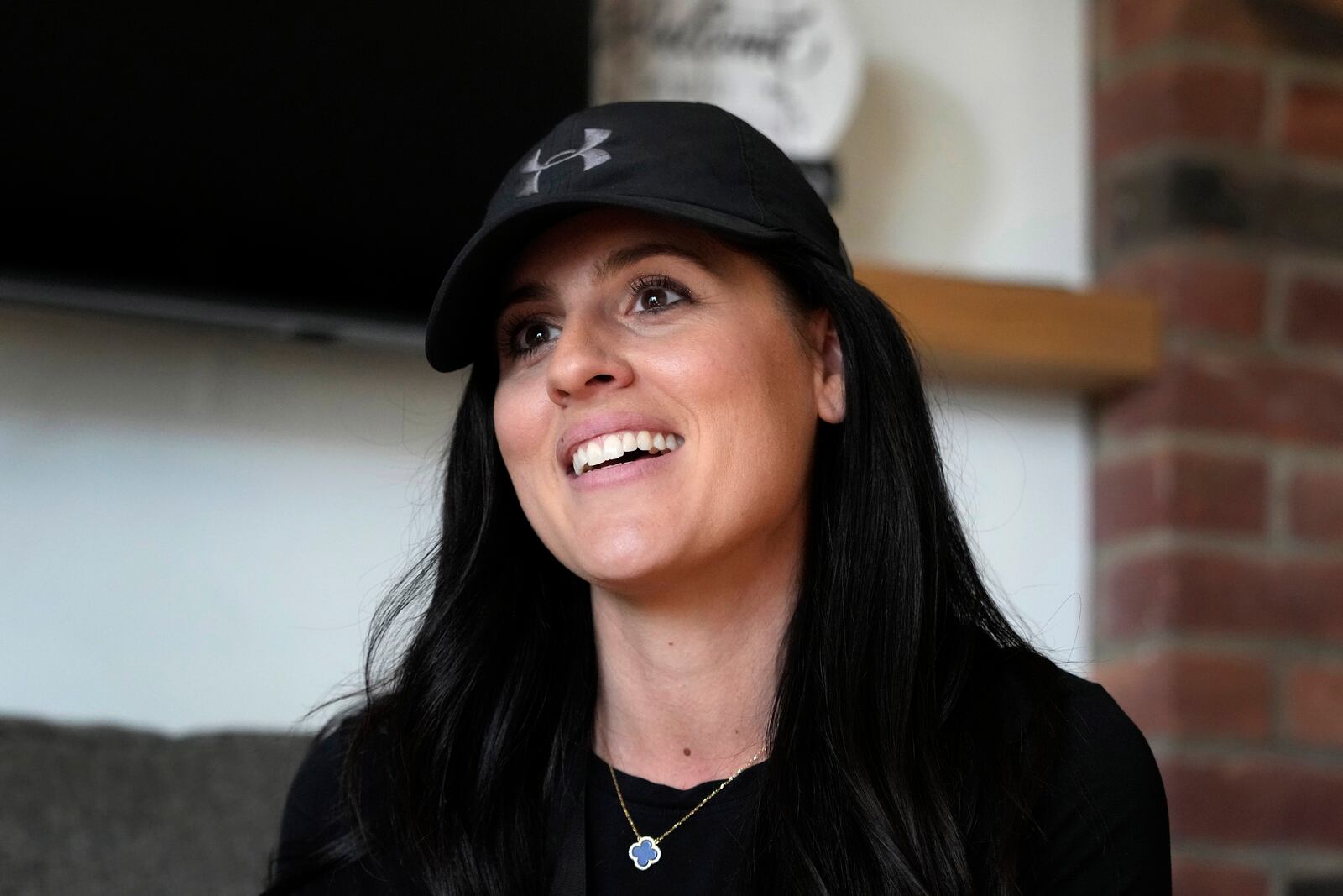 Democratic state Rep. Jaime Churches, a former elementary school teacher, is interviewed in her campaign office, Friday, Oct. 11, 2024, in Trenton, Mich. (AP Photo/Carlos Osorio)