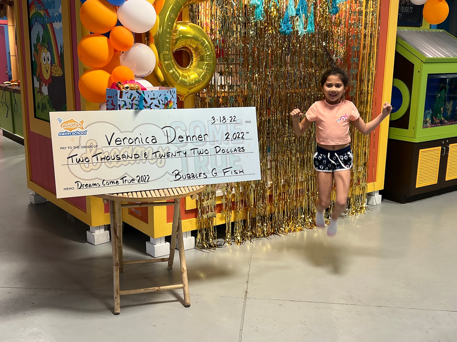 Veronica Dehner of Centerville is jumping for joy over her $2,022 award presented to her this month at Goldfish Swim School in Centerville. She was one of two students nationwide to be chosen at random to win after submitting her vision board as part of the national event. CONTRIBUTED