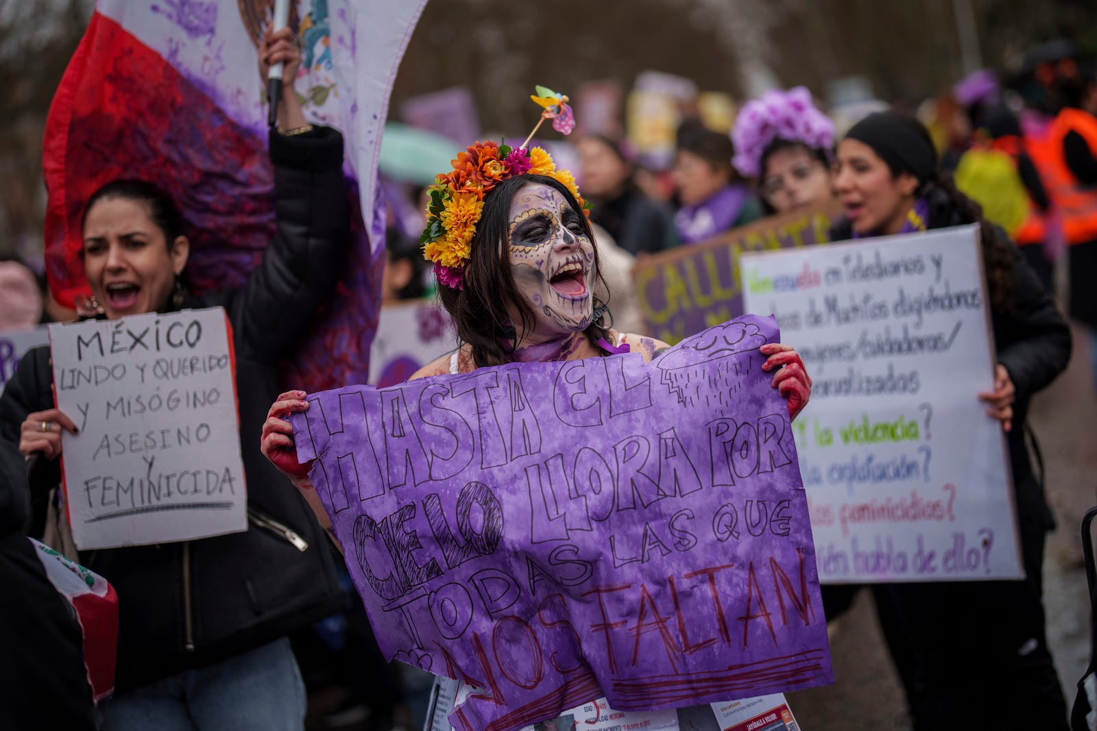 Demonstrators rally during an International Women's Day protest in Madrid, Spain, Saturday, March 8, 2025. (AP Photo/Bernat Armangue)