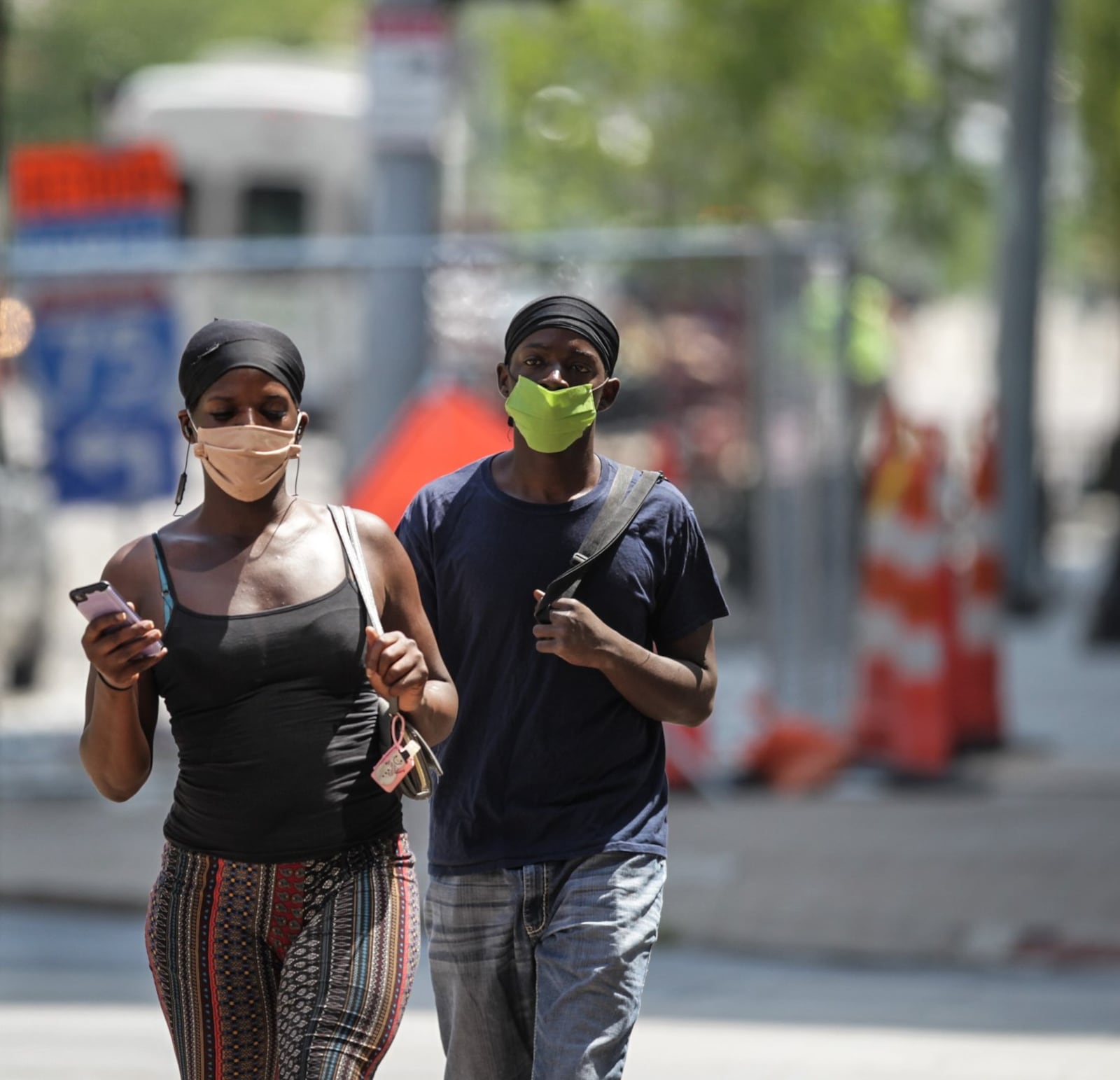 Joshua Brown, left and Alvarado Taylor walk to the store on Third Street in Dayton. Gov. Mike DeWine announced new mask requirements for seven counties, including Montgomery and Butler, listed as having a higher risk of coronavirus exposure and spread. The requirement begins at 6 p.m. Wednesday and will last as long as the seven counties are in Level 3 or 4 of the governor s new alert system. JIM NOELKER/STAFF